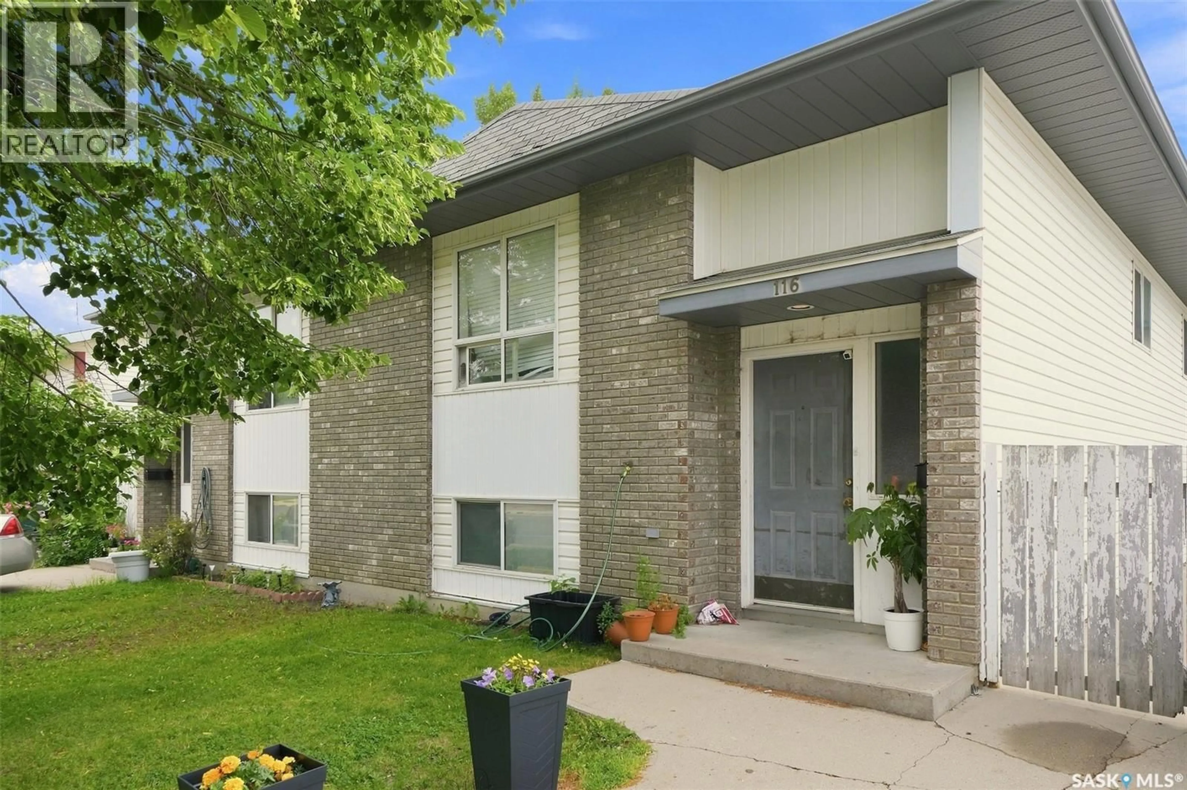 Home with brick exterior material, street for 114 - 116 BARBER CRESCENT, Saskatoon Saskatchewan S7M5M7