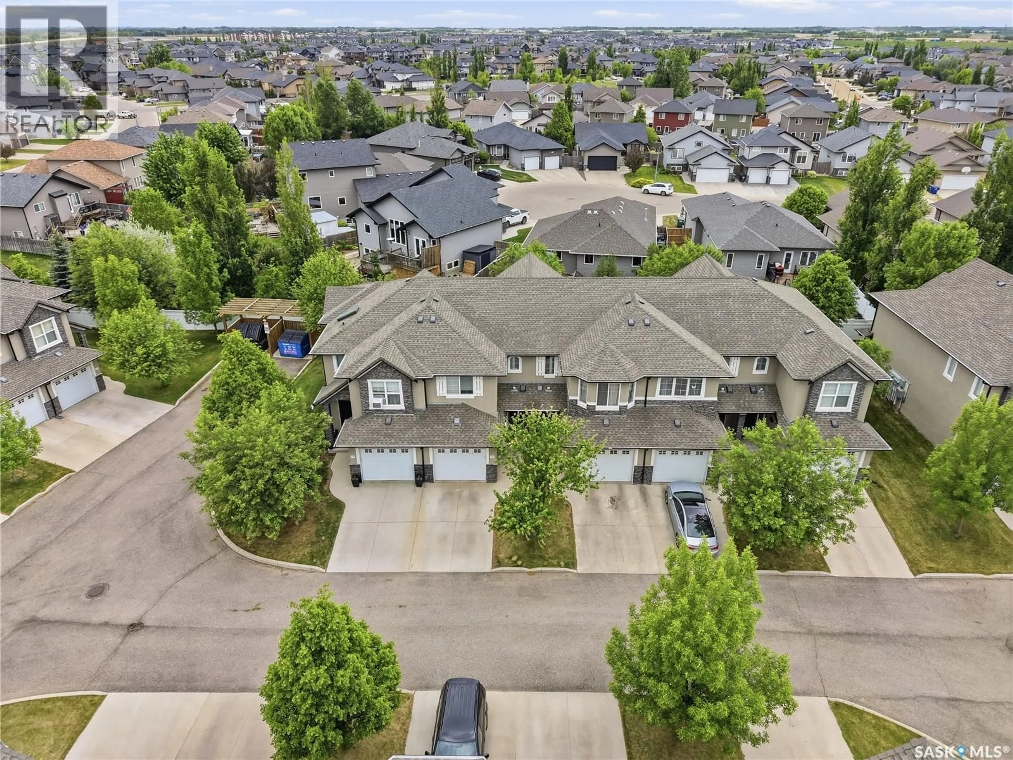 A pic from outside/outdoor area/front of a property/back of a property/a pic from drone, street for 309 - 410 HUNTER ROAD, Saskatoon Saskatchewan S7T0L5