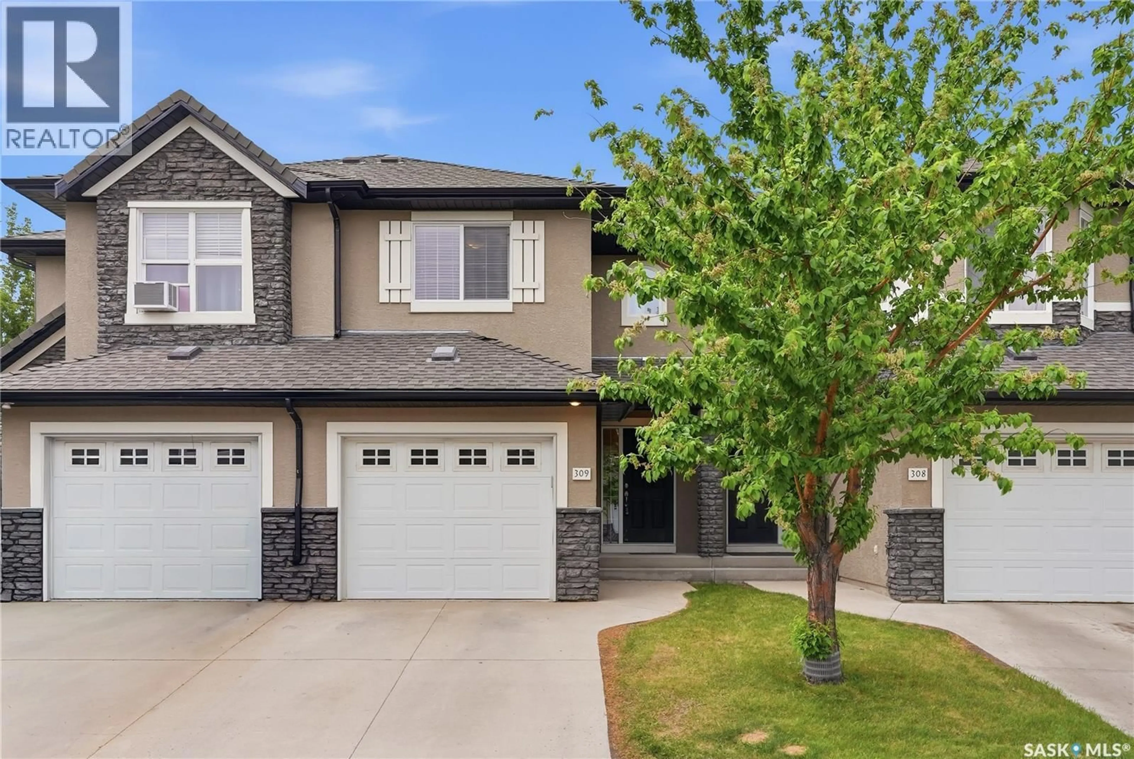 Home with vinyl exterior material, street for 309 - 410 HUNTER ROAD, Saskatoon Saskatchewan S7T0L5