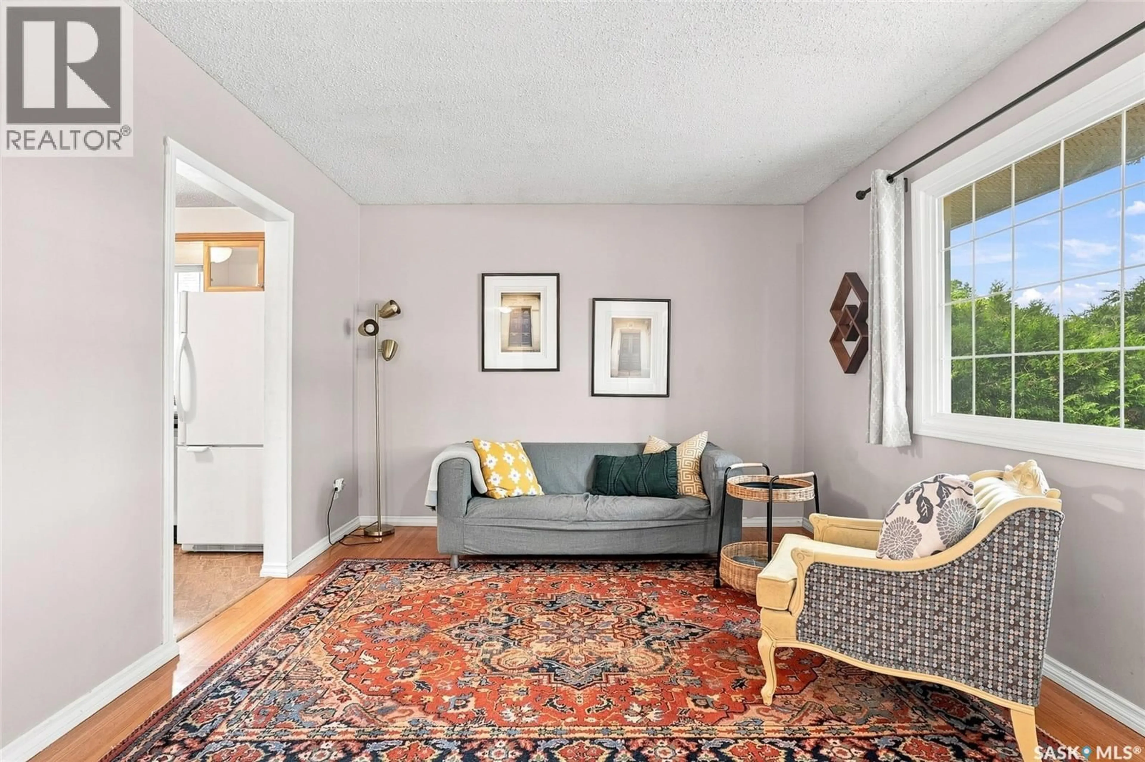 Living room with furniture, carpet floor for 1714 DRINKLE STREET, Saskatoon Saskatchewan S7J0P7