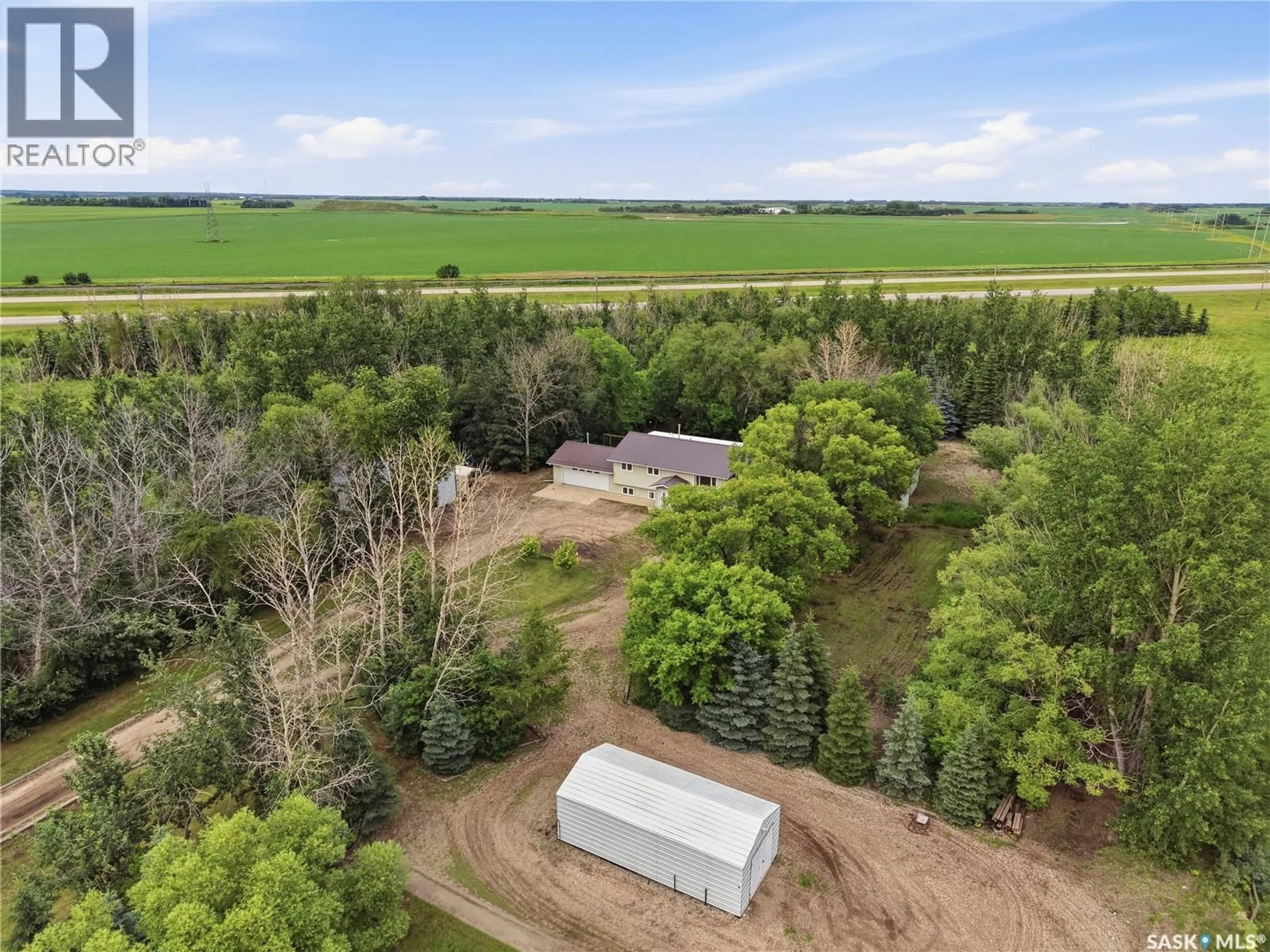 A pic from outside/outdoor area/front of a property/back of a property/a pic from drone, forest/trees view for ACREAGE EAST, Corman Park Rm No. 344 Saskatchewan S7K3J8