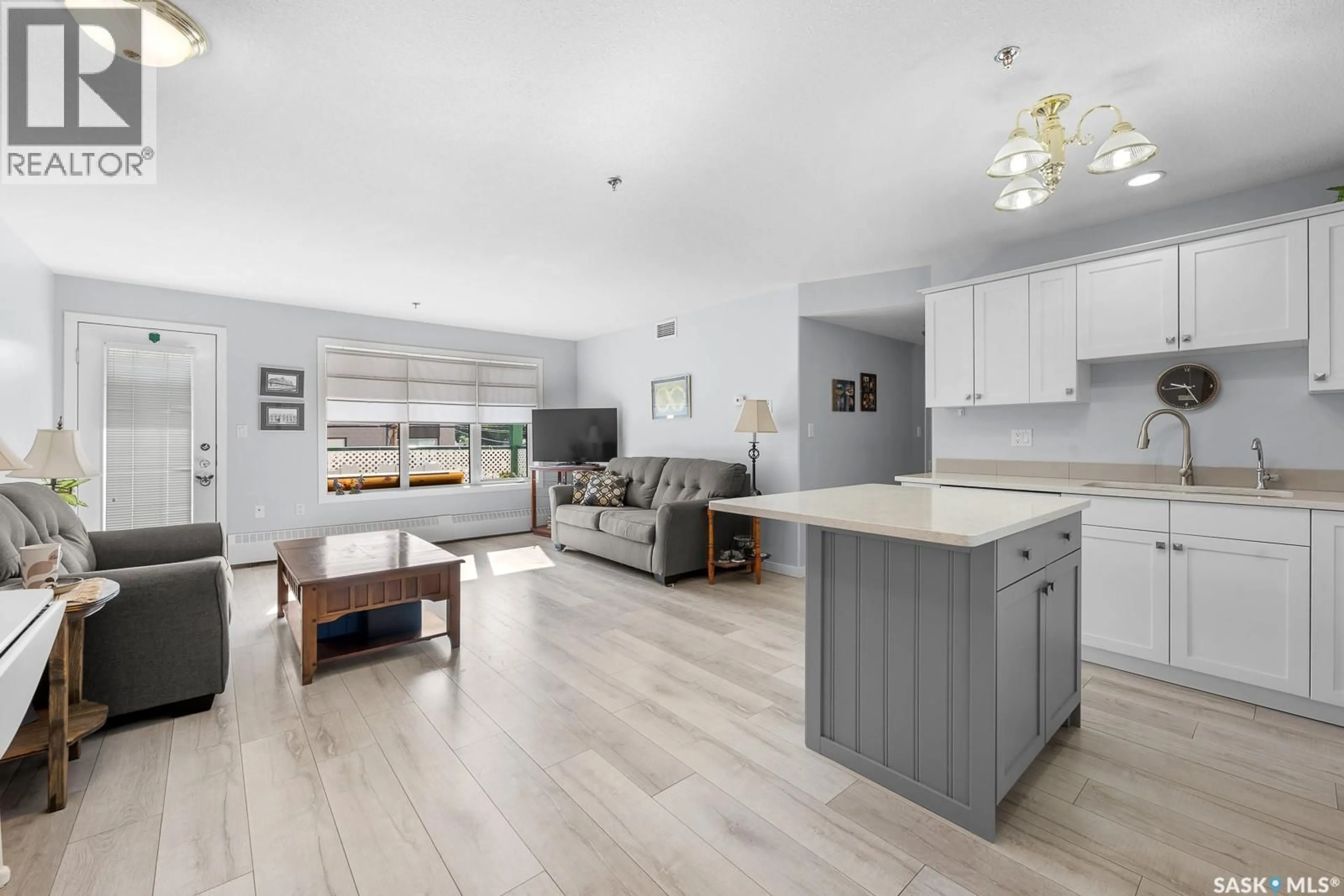 Open concept kitchen, wood/laminate floor for 207 MCINTYRE STREET, Regina Saskatchewan S4R3B7