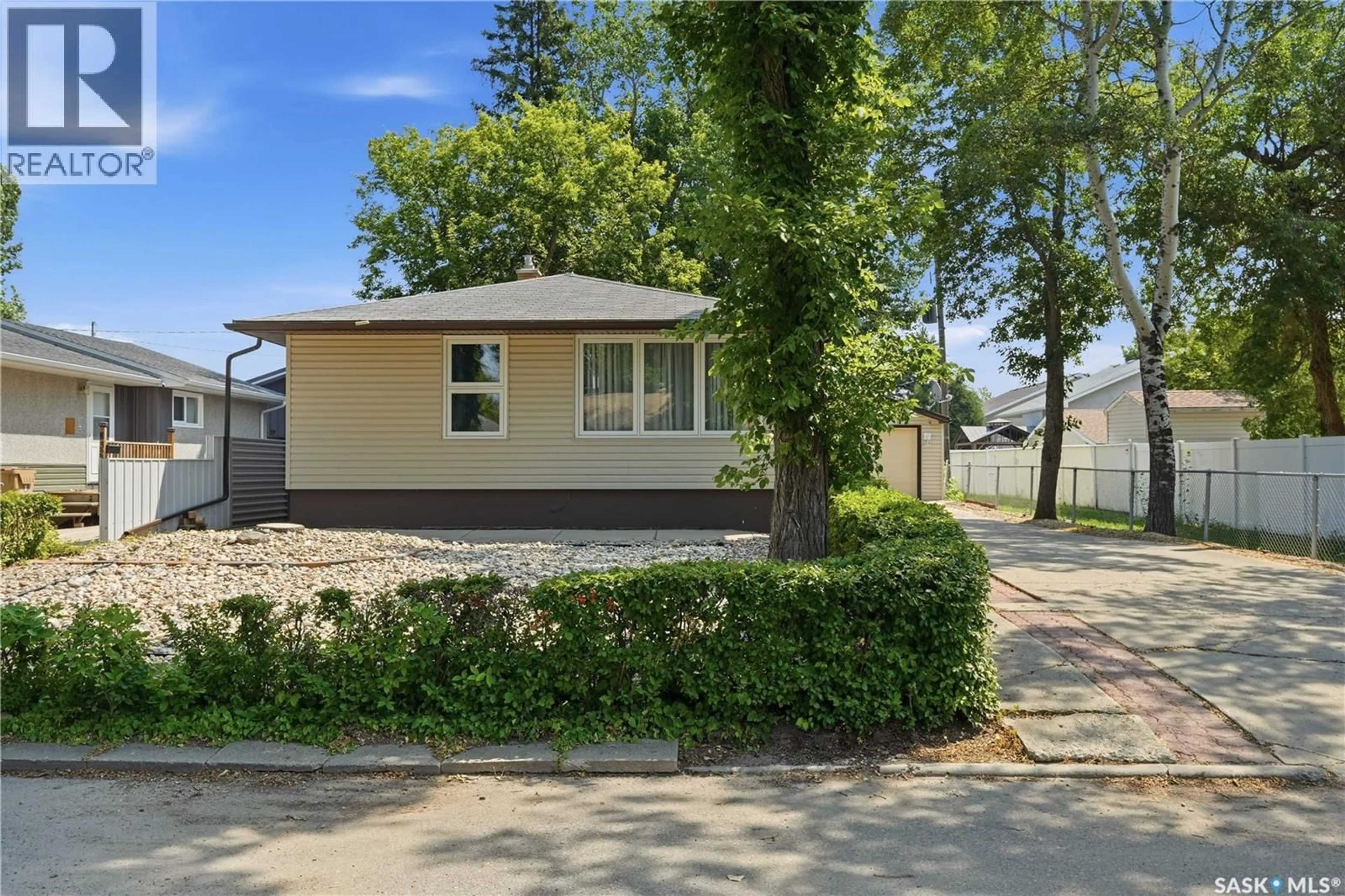 Home with vinyl exterior material, street for 323 TORONTO STREET, Regina Saskatchewan S4R2T7
