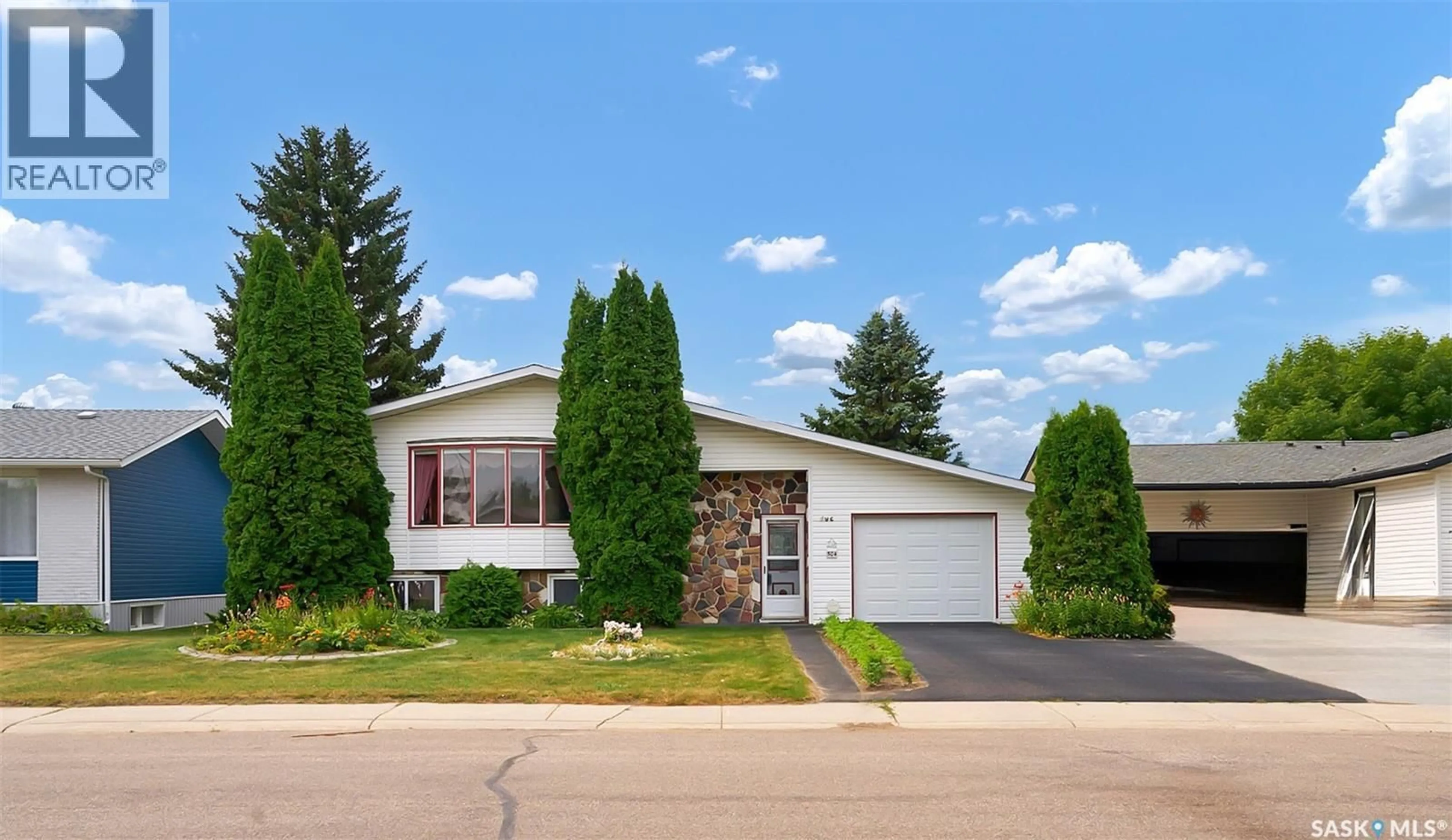 Home with vinyl exterior material, street for 504 4TH AVENUE, Biggar Saskatchewan S0K0M0
