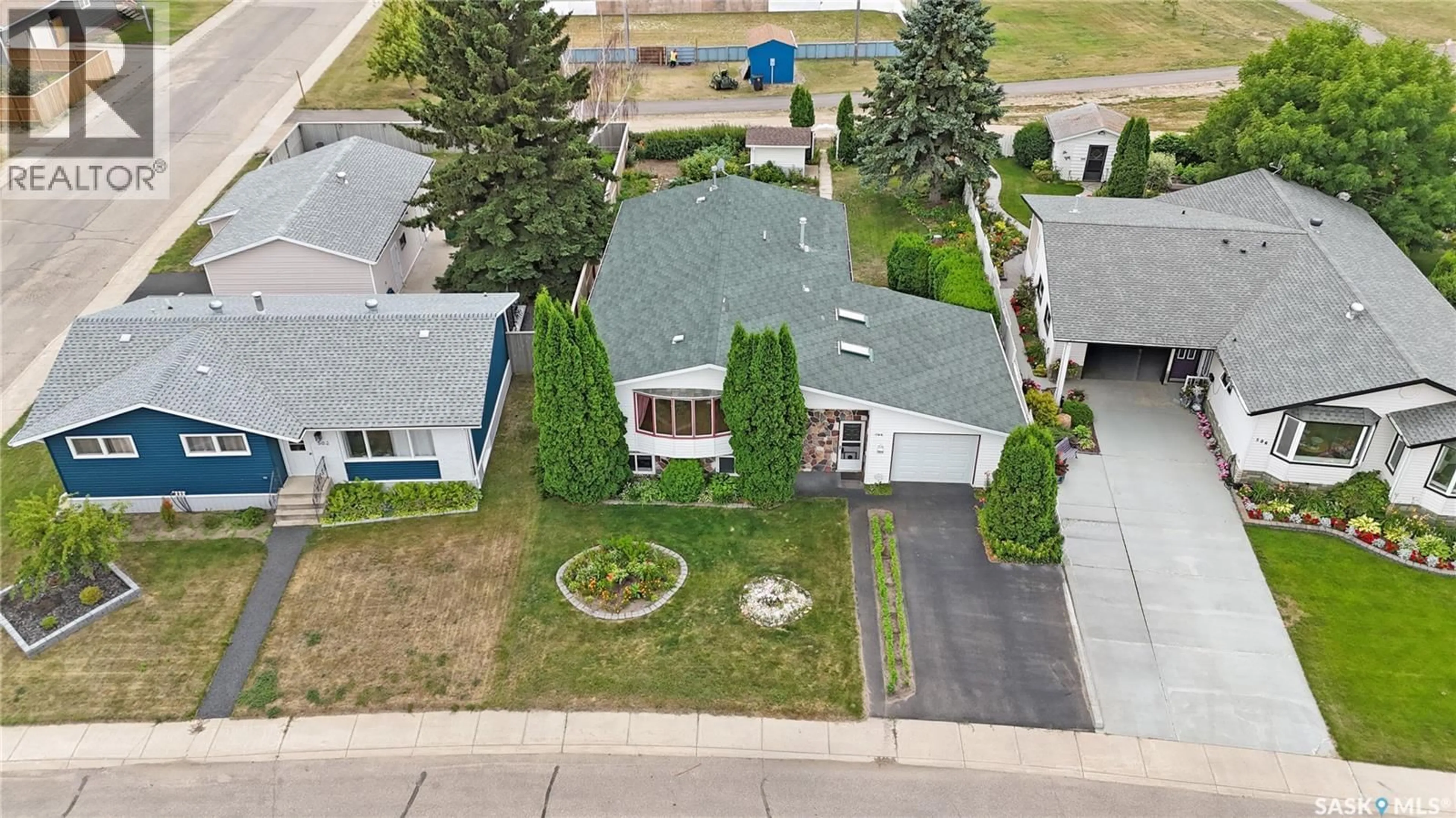 A pic from outside/outdoor area/front of a property/back of a property/a pic from drone, street for 504 4TH AVENUE, Biggar Saskatchewan S0K0M0