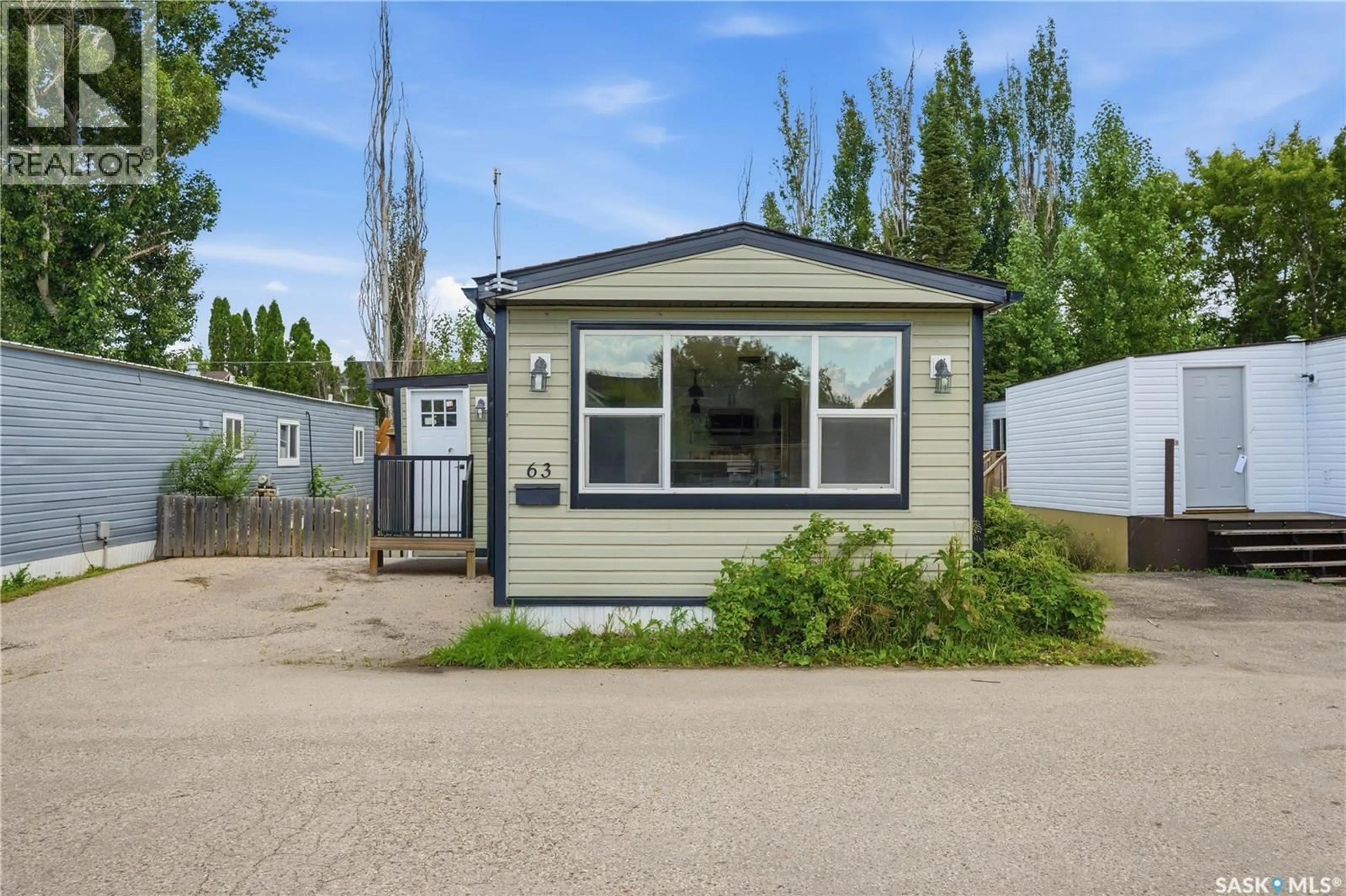 Home with vinyl exterior material, street for 63 219 GRANT STREET, Saskatoon Saskatchewan S7N2A5