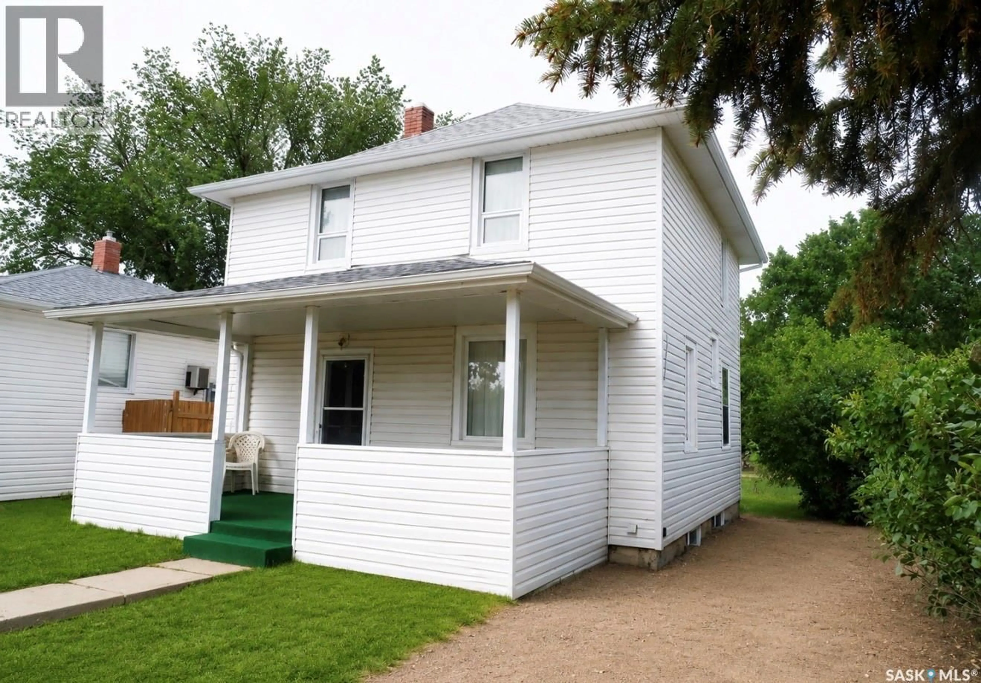 Home with vinyl exterior material, street for 311 7TH AVENUE, Assiniboia Saskatchewan S0H0B0