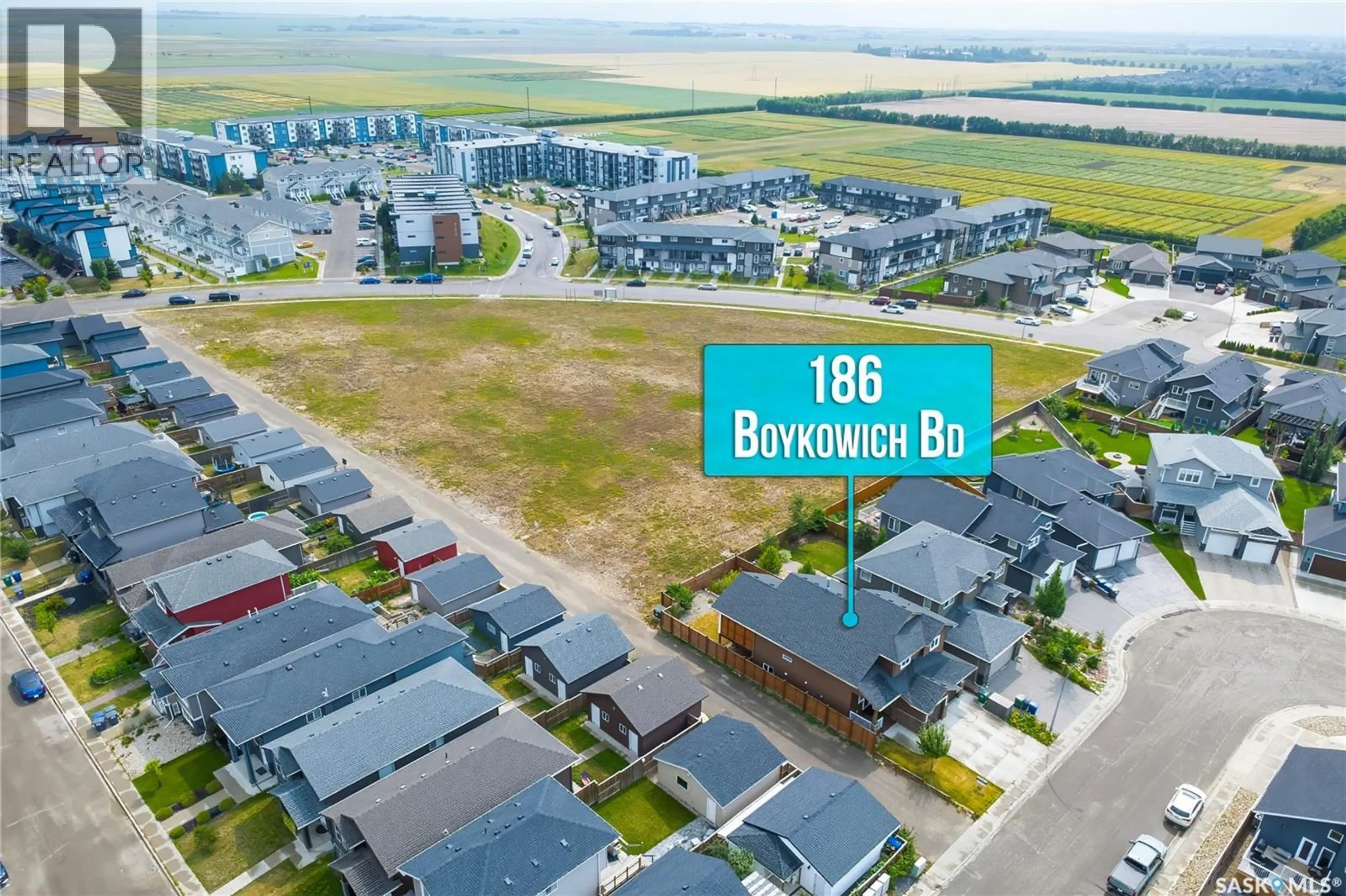 A pic from outside/outdoor area/front of a property/back of a property/a pic from drone, street for 186 BOYKOWICH BEND, Saskatoon Saskatchewan S7W0S4