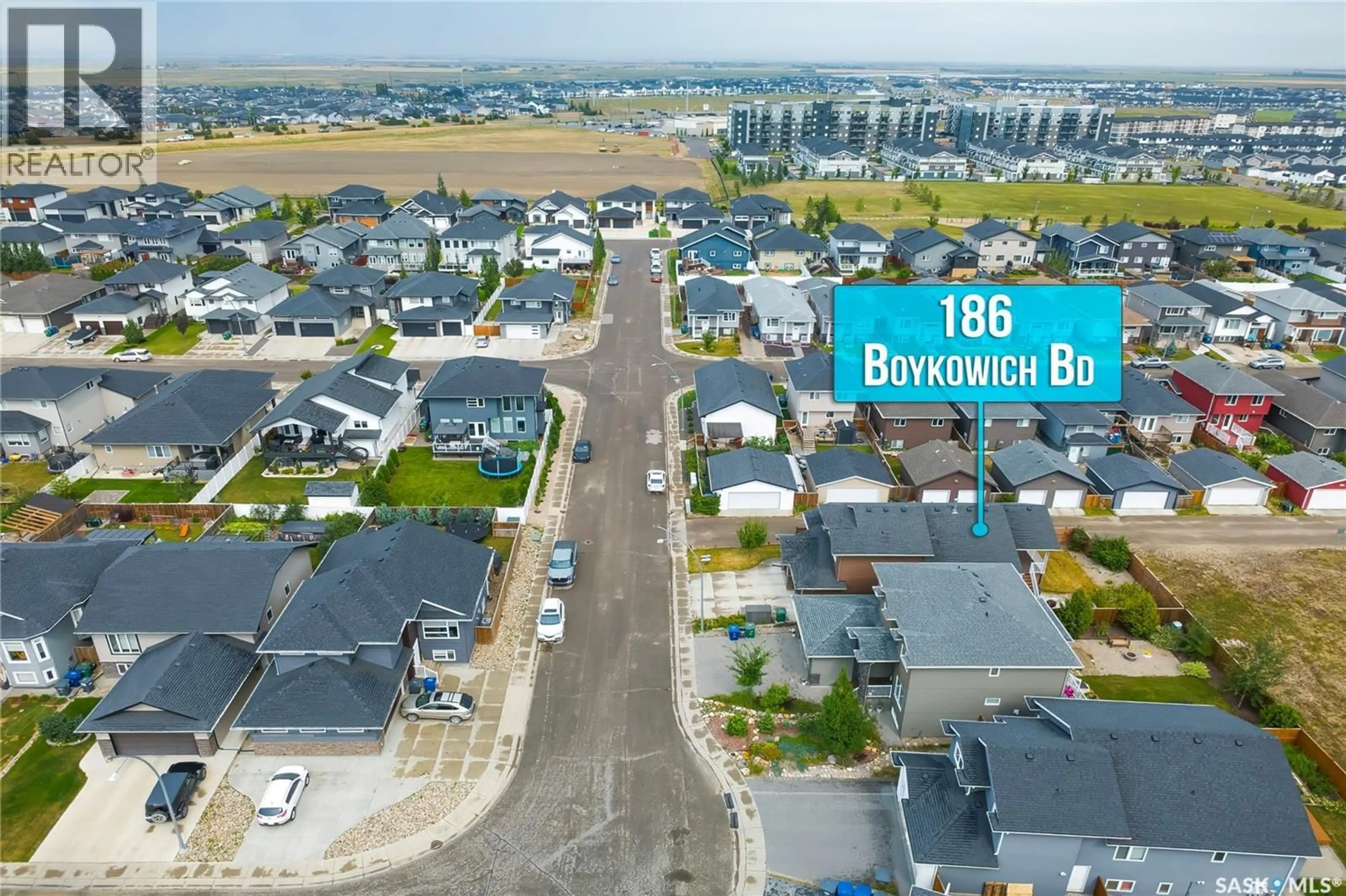A pic from outside/outdoor area/front of a property/back of a property/a pic from drone, street for 186 BOYKOWICH BEND, Saskatoon Saskatchewan S7W0S4