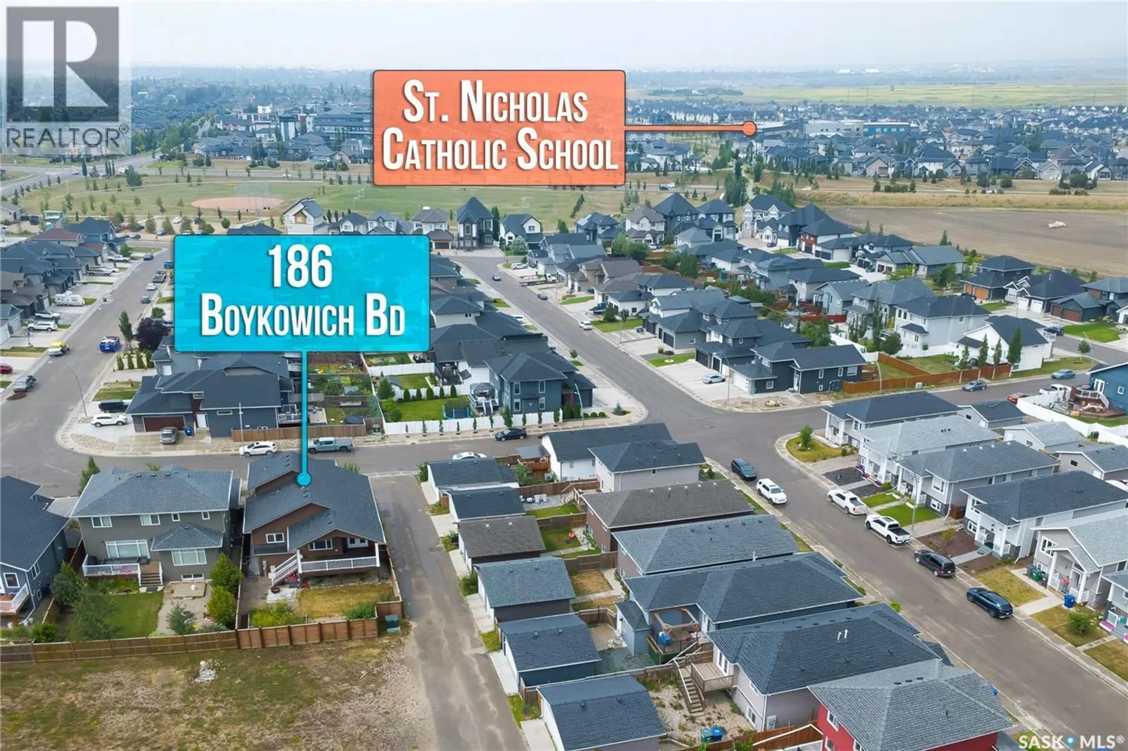A pic from outside/outdoor area/front of a property/back of a property/a pic from drone, street for 186 BOYKOWICH BEND, Saskatoon Saskatchewan S7W0S4