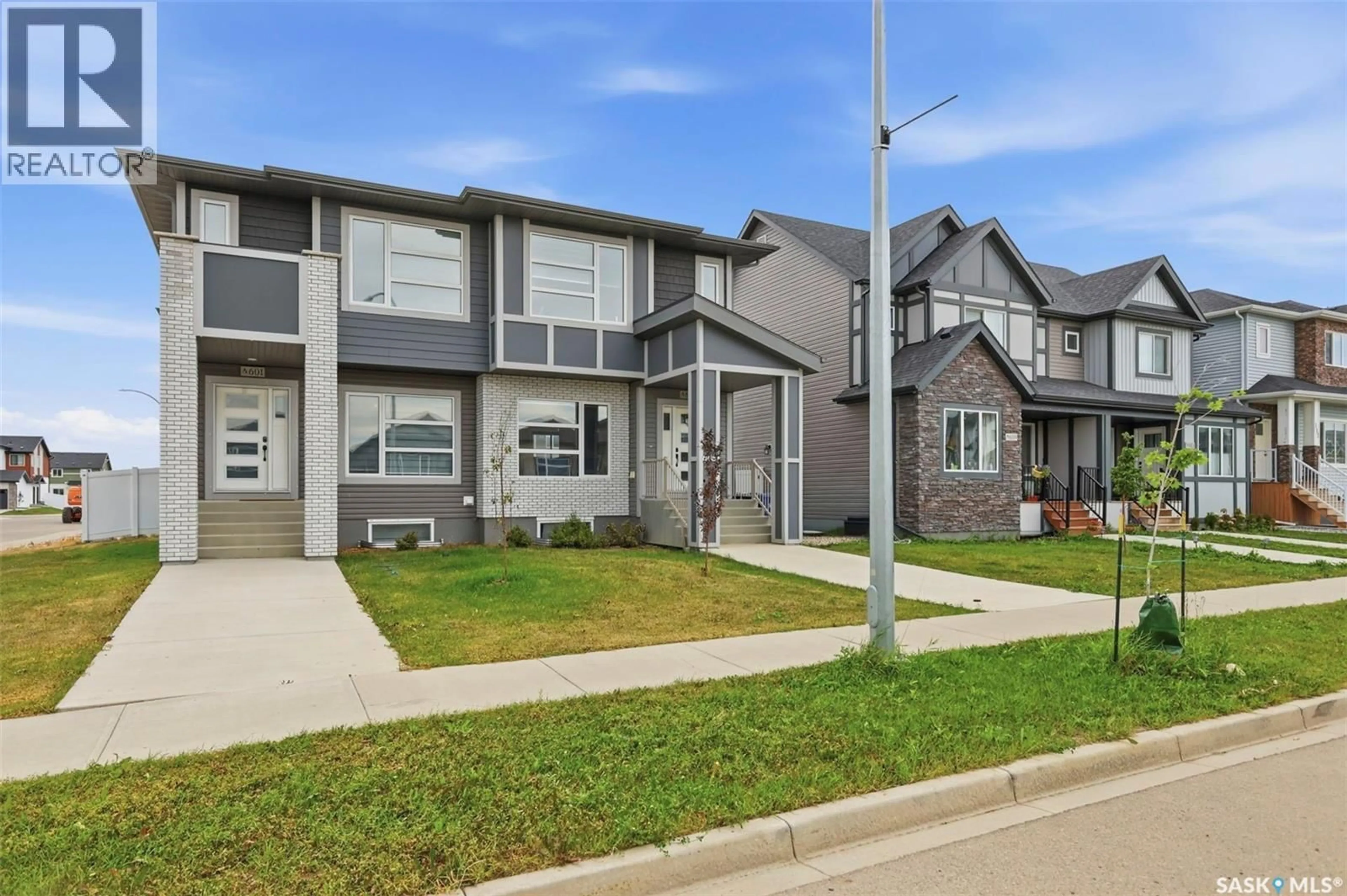 Home with vinyl exterior material, street for 605 FEHEREGYHAZI BOULEVARD, Saskatoon Saskatchewan S7W0Z4