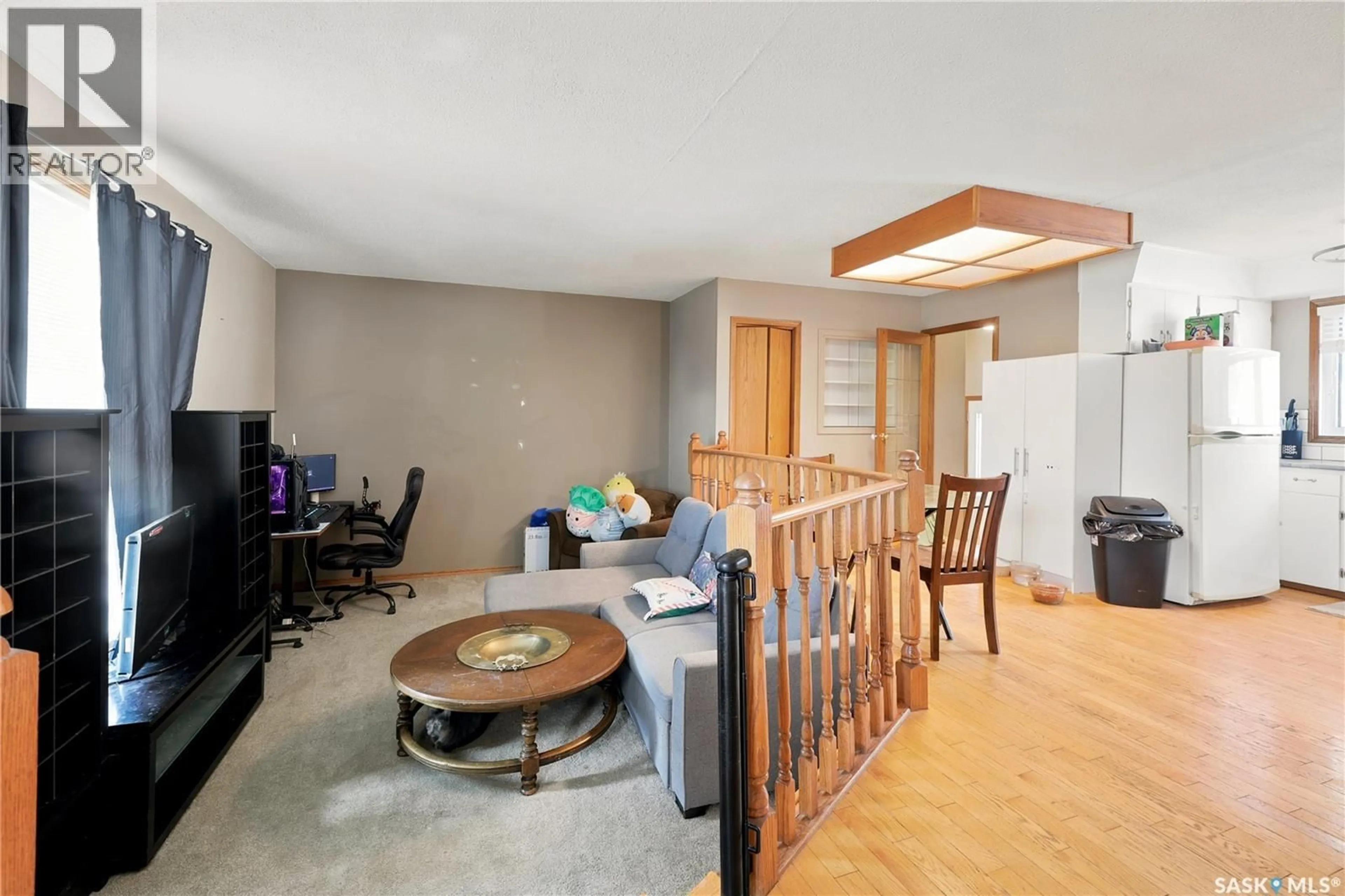 Living room with furniture, wood/laminate floor for 1434 HOCHELAGA STREET, Moose Jaw Saskatchewan S6H6G5