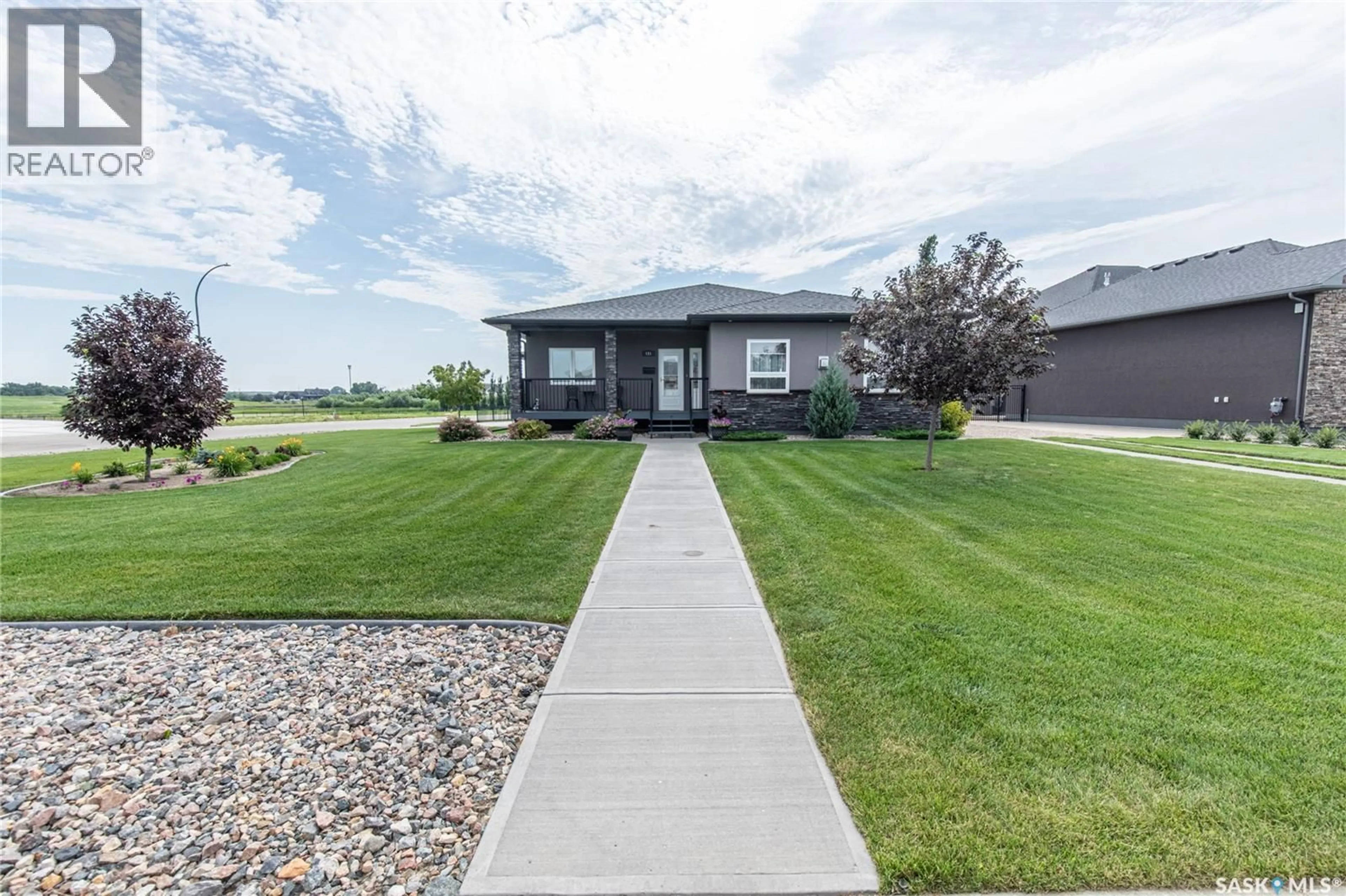 Home with vinyl exterior material, street for 111 IRON BRIDGE DRIVE, Moose Jaw Saskatchewan S6J0B4
