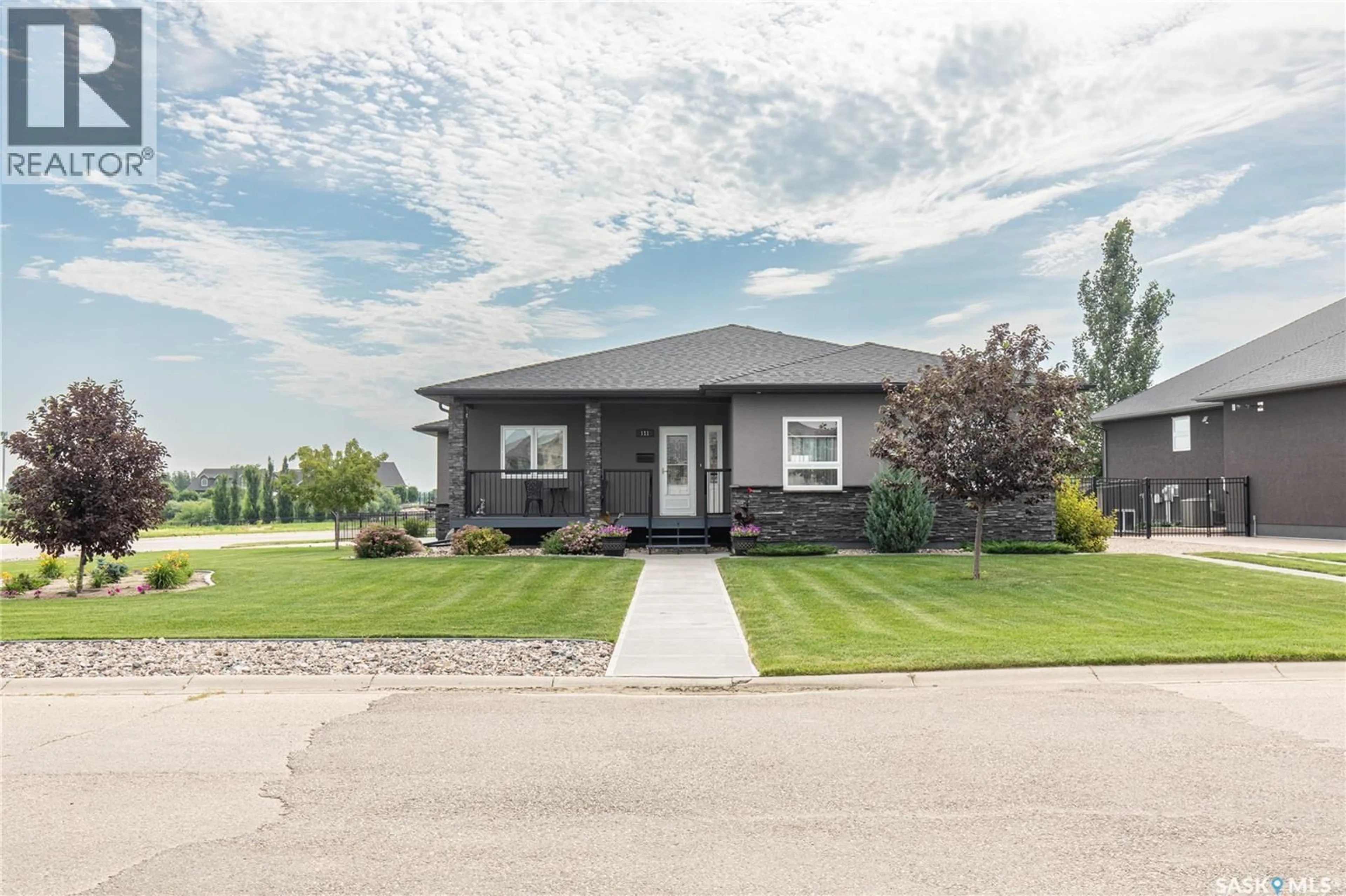 Home with vinyl exterior material, street for 111 IRON BRIDGE DRIVE, Moose Jaw Saskatchewan S6J0B4