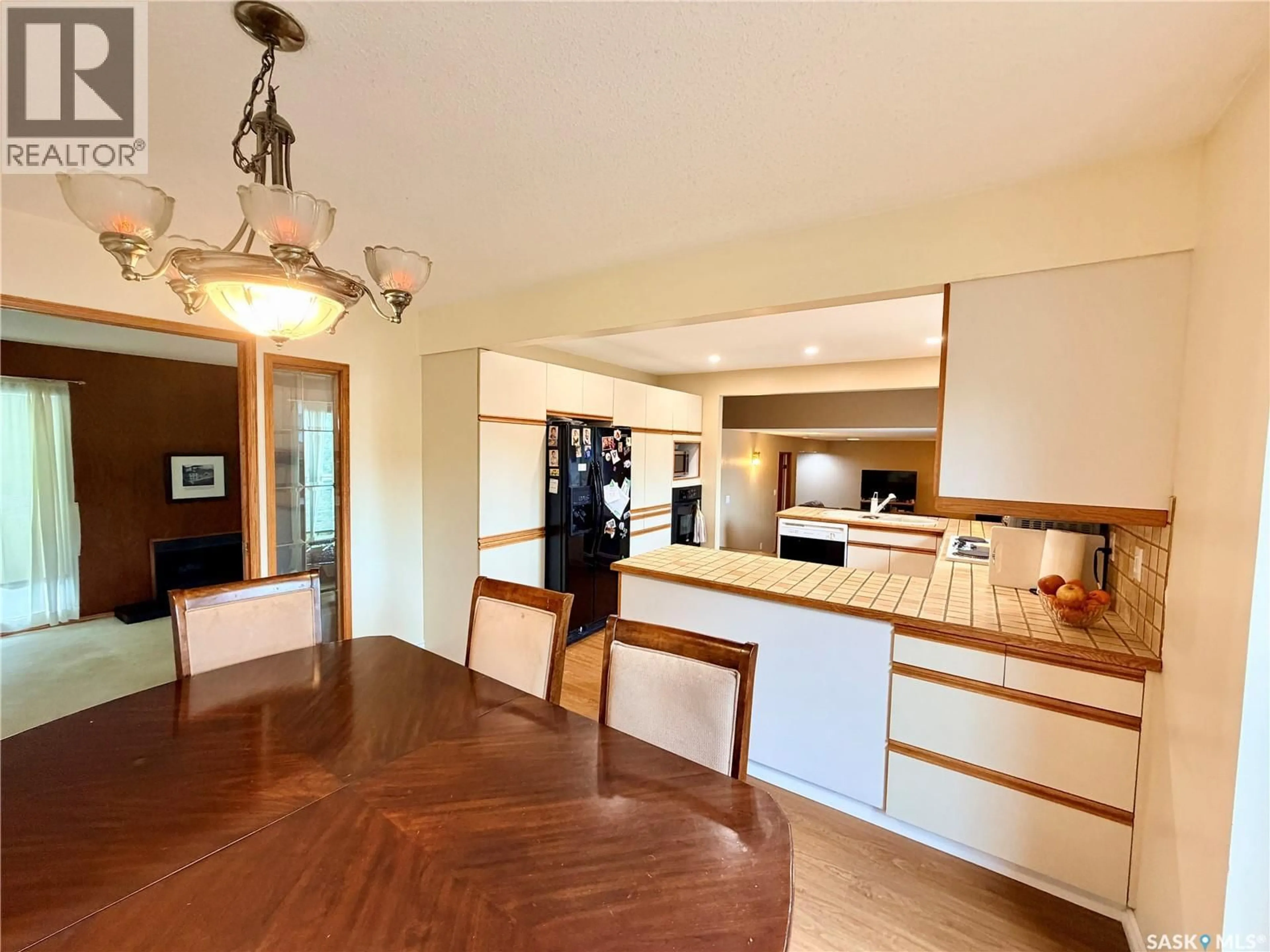 Open concept kitchen, wood/laminate floor for 2173 DOUGLAS AVENUE, North Battleford Saskatchewan S9A3N9