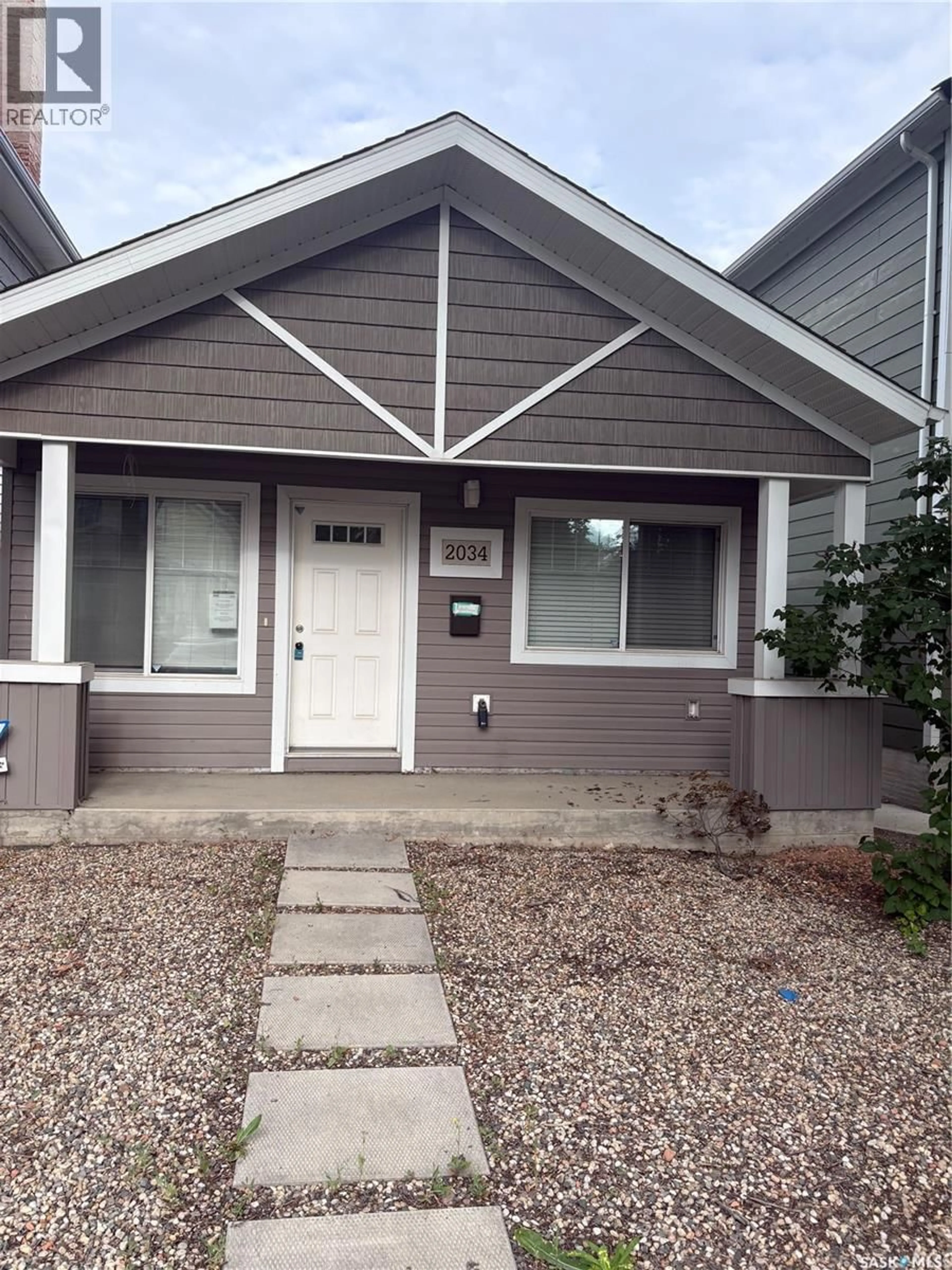 Home with vinyl exterior material, street for 2034 ST JOHN STREET, Regina Saskatchewan S4P1S4
