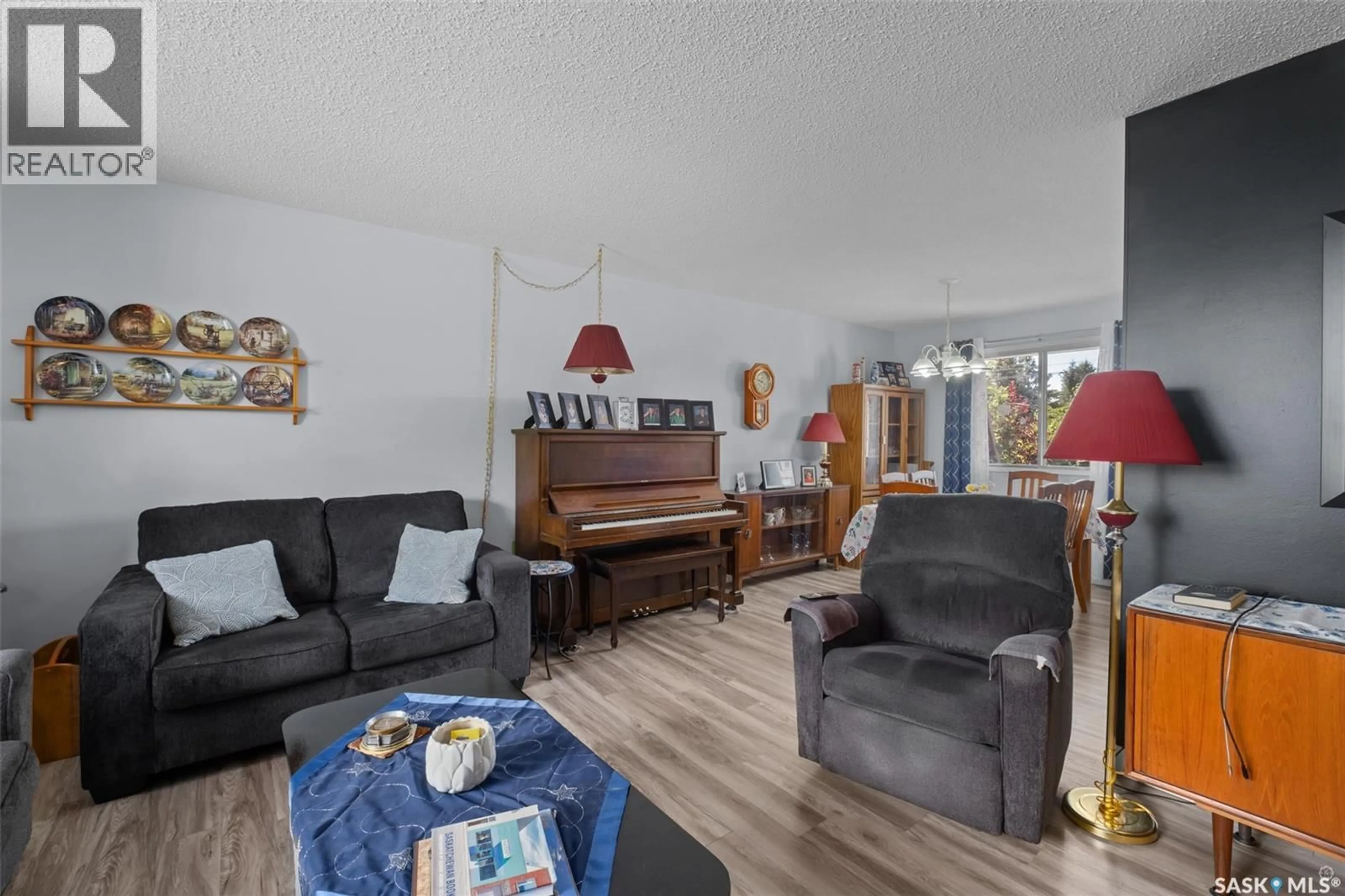 Living room with furniture, wood/laminate floor for 463 30TH STREET, Prince Albert Saskatchewan S6V1Z5