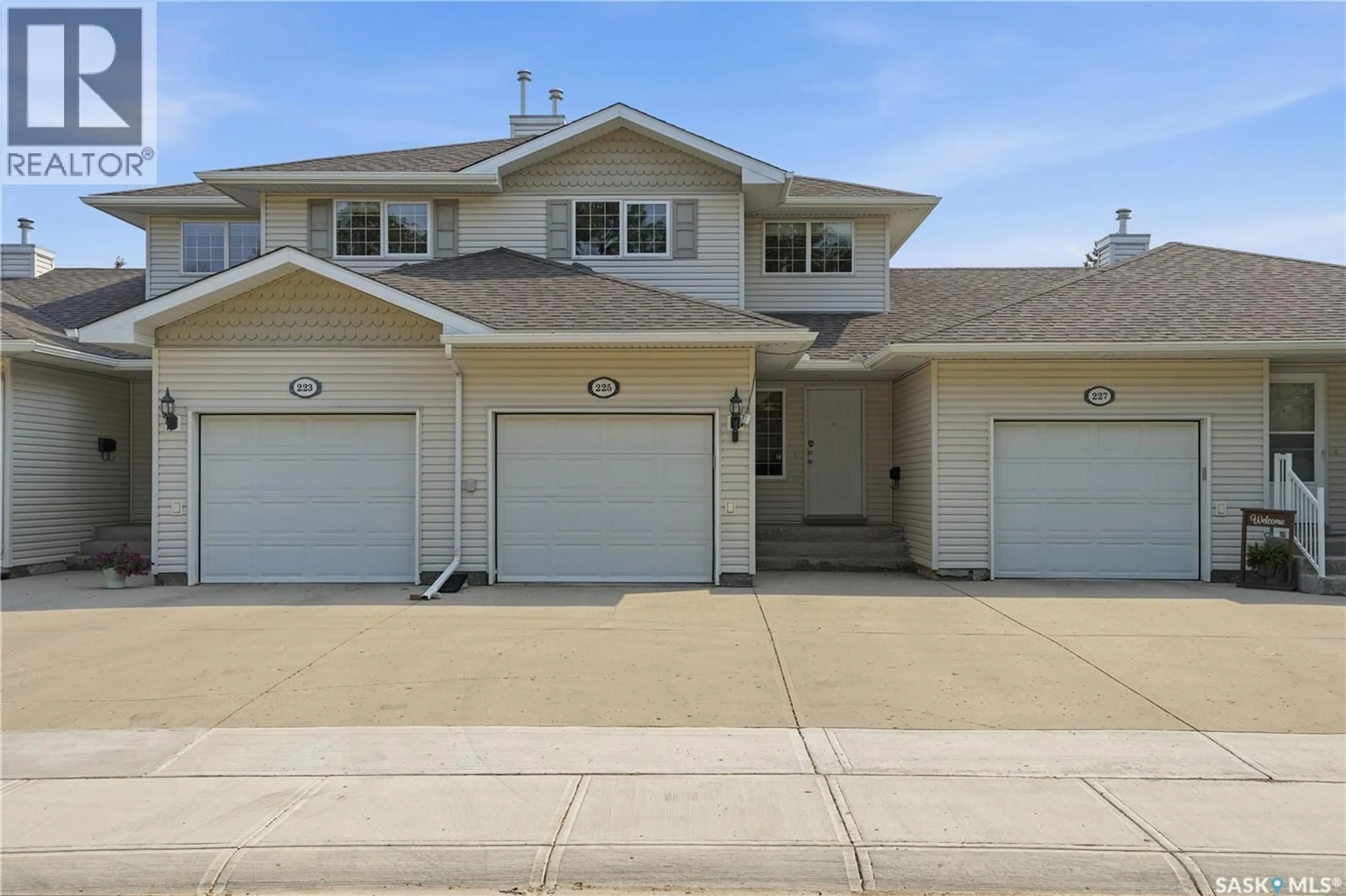 Home with vinyl exterior material, street for 225 MIKKELSON DRIVE, Regina Saskatchewan S4T7X9