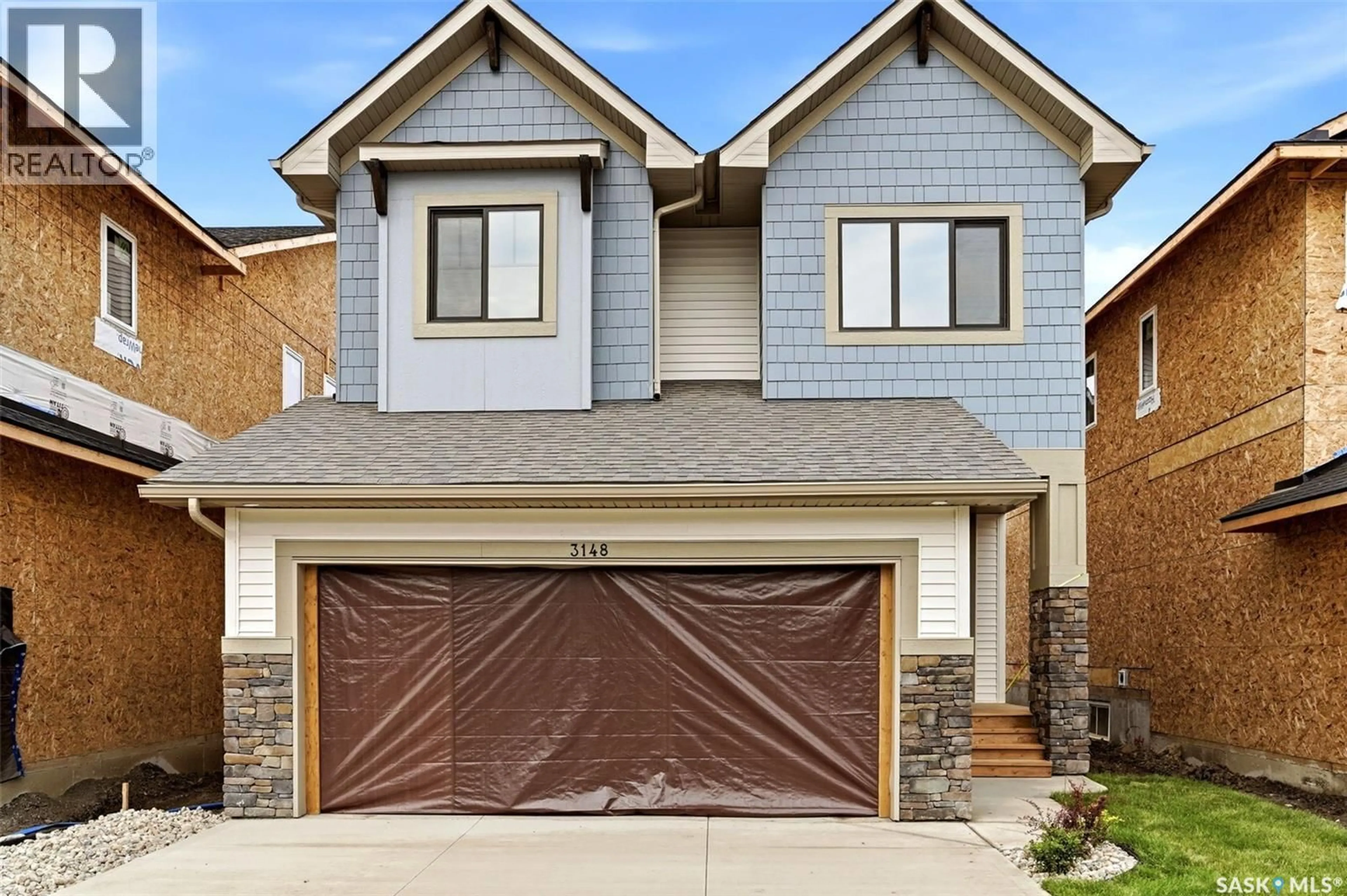 Home with brick exterior material, street for 3148 FAVEL DRIVE, Regina Saskatchewan S4V4C7