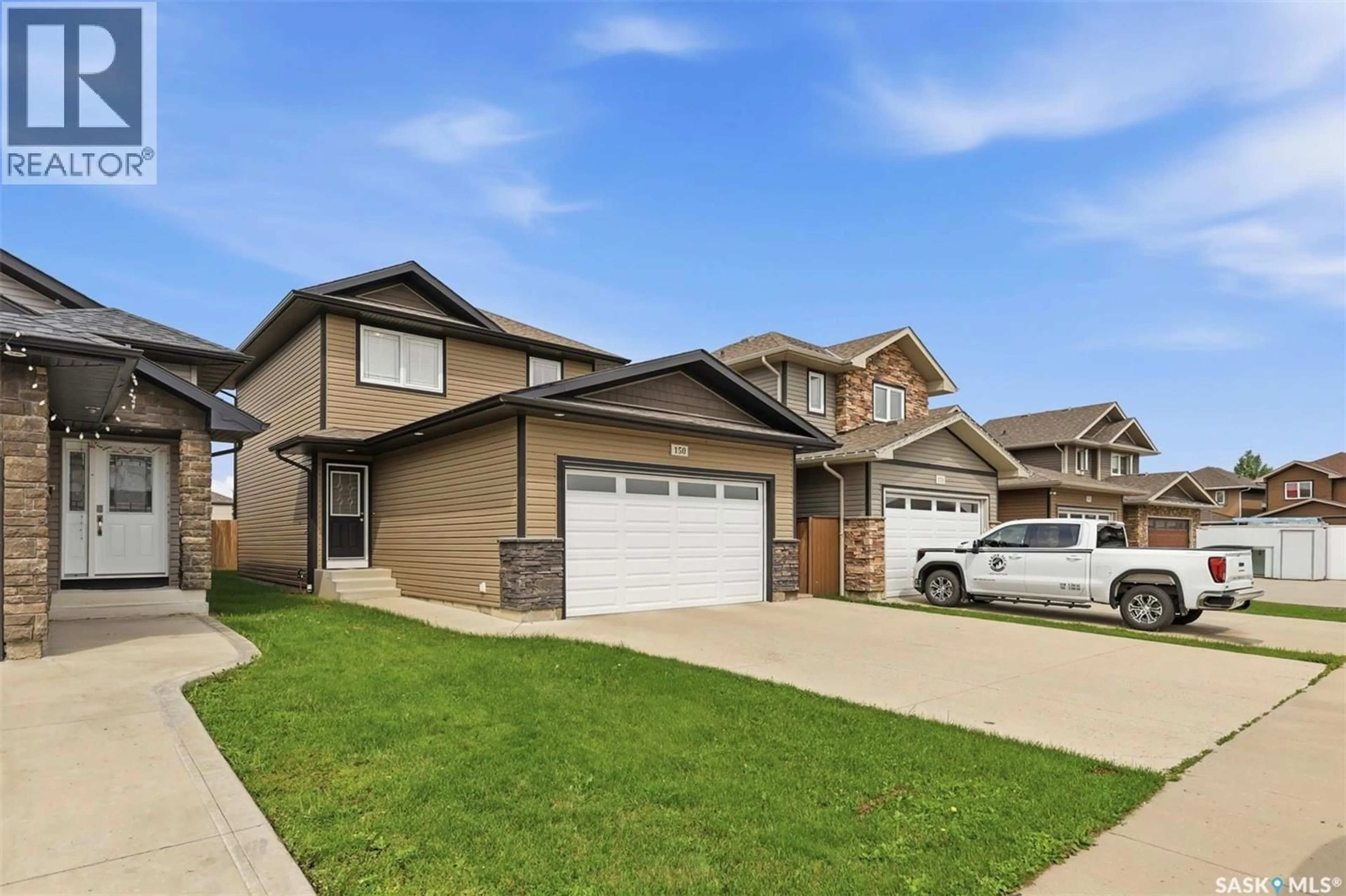 Home with vinyl exterior material, street for 150 HENICK CRESCENT, Saskatoon Saskatchewan S7R0J9