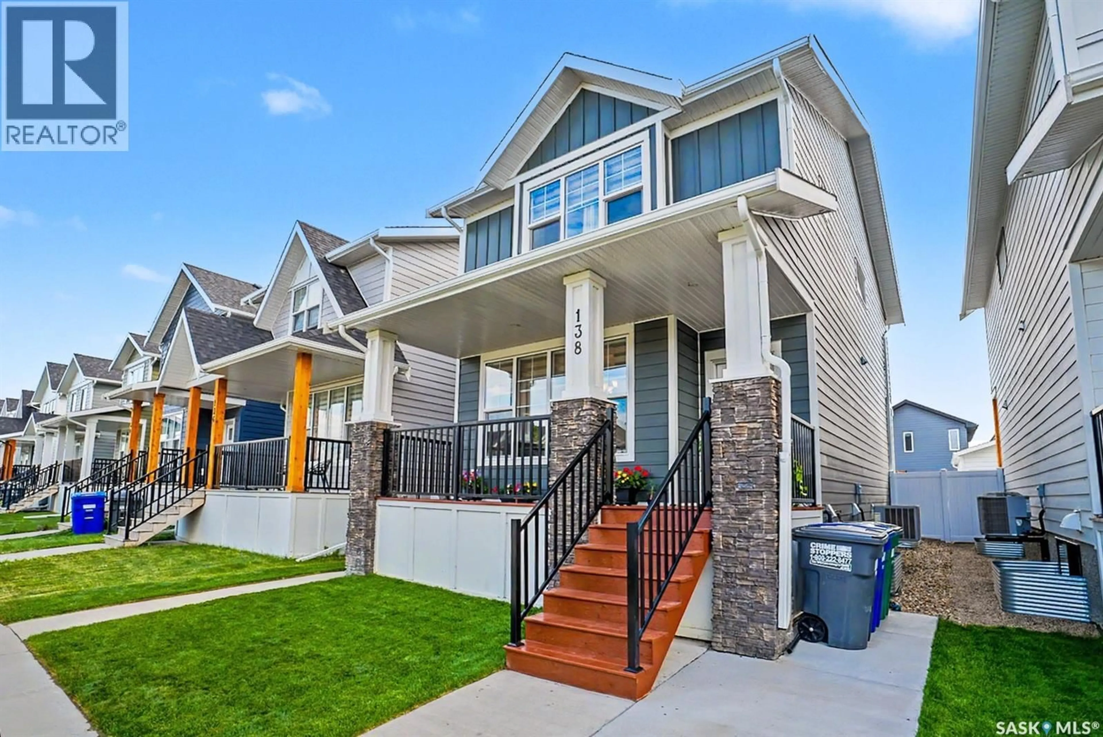 Home with vinyl exterior material, street for 138 ROSEWOOD BOULEVARD, Saskatoon Saskatchewan S7V0Y9