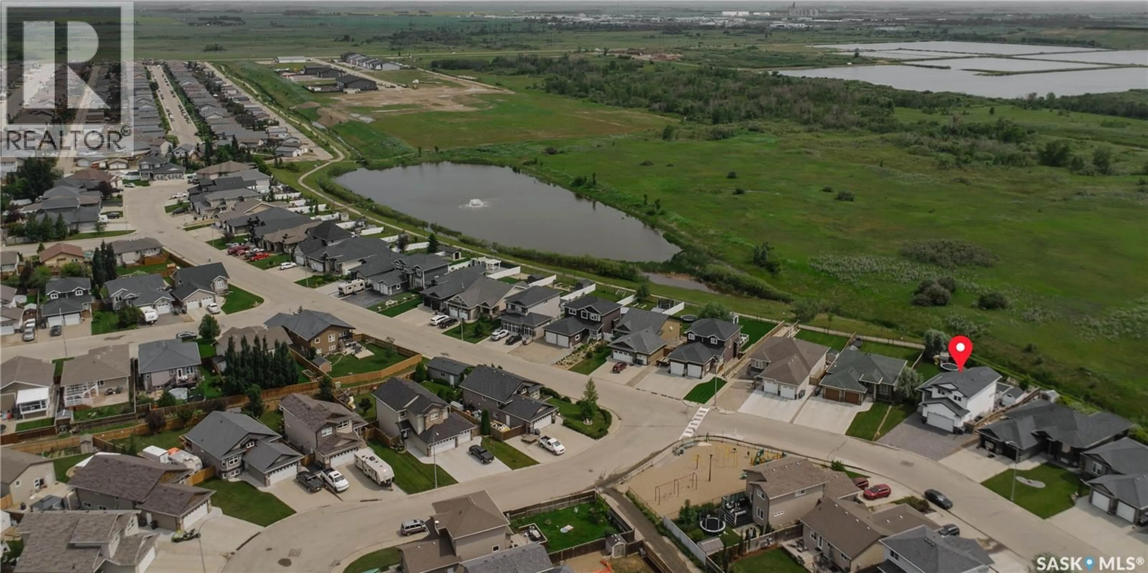 A pic from outside/outdoor area/front of a property/back of a property/a pic from drone, water/lake/river/ocean view for 400 STONE TERRACE, Martensville Saskatchewan S0K0A2
