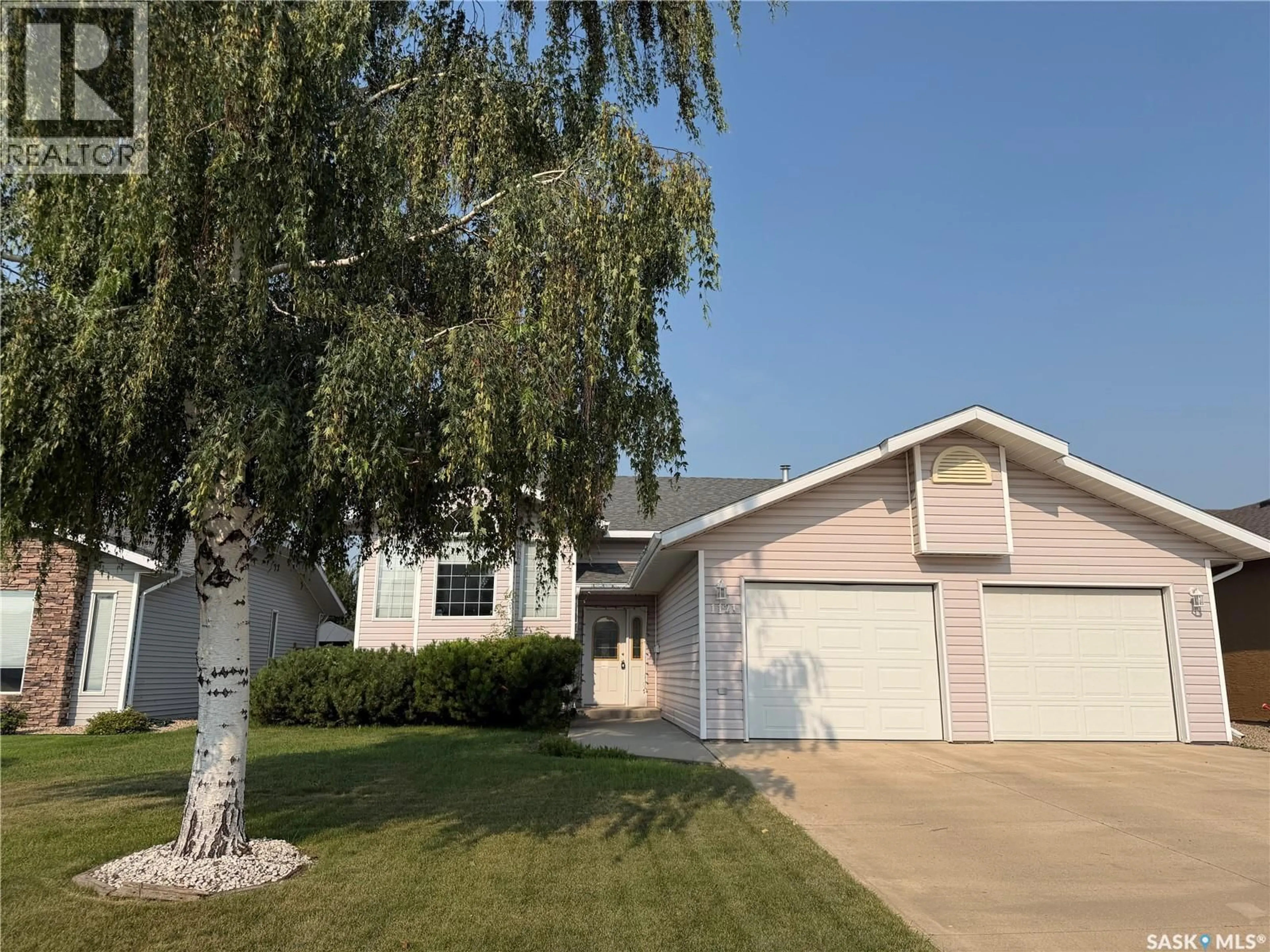 Home with vinyl exterior material, street for 1121 21ST STREET, Humboldt Saskatchewan S0K2A0