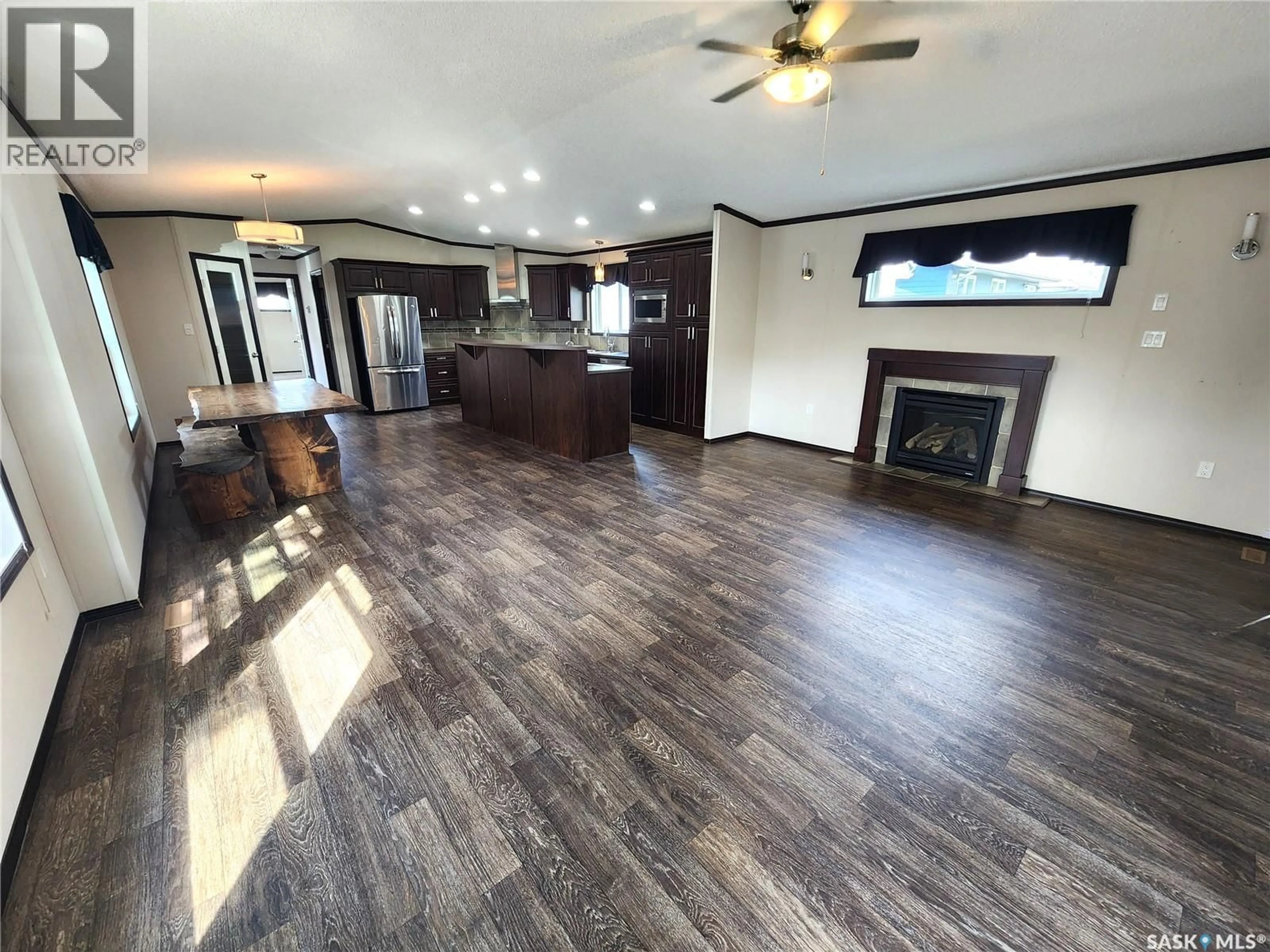 Open concept kitchen, wood/laminate floor for 417 YOUNG STREET, Bienfait Saskatchewan S0C0M0