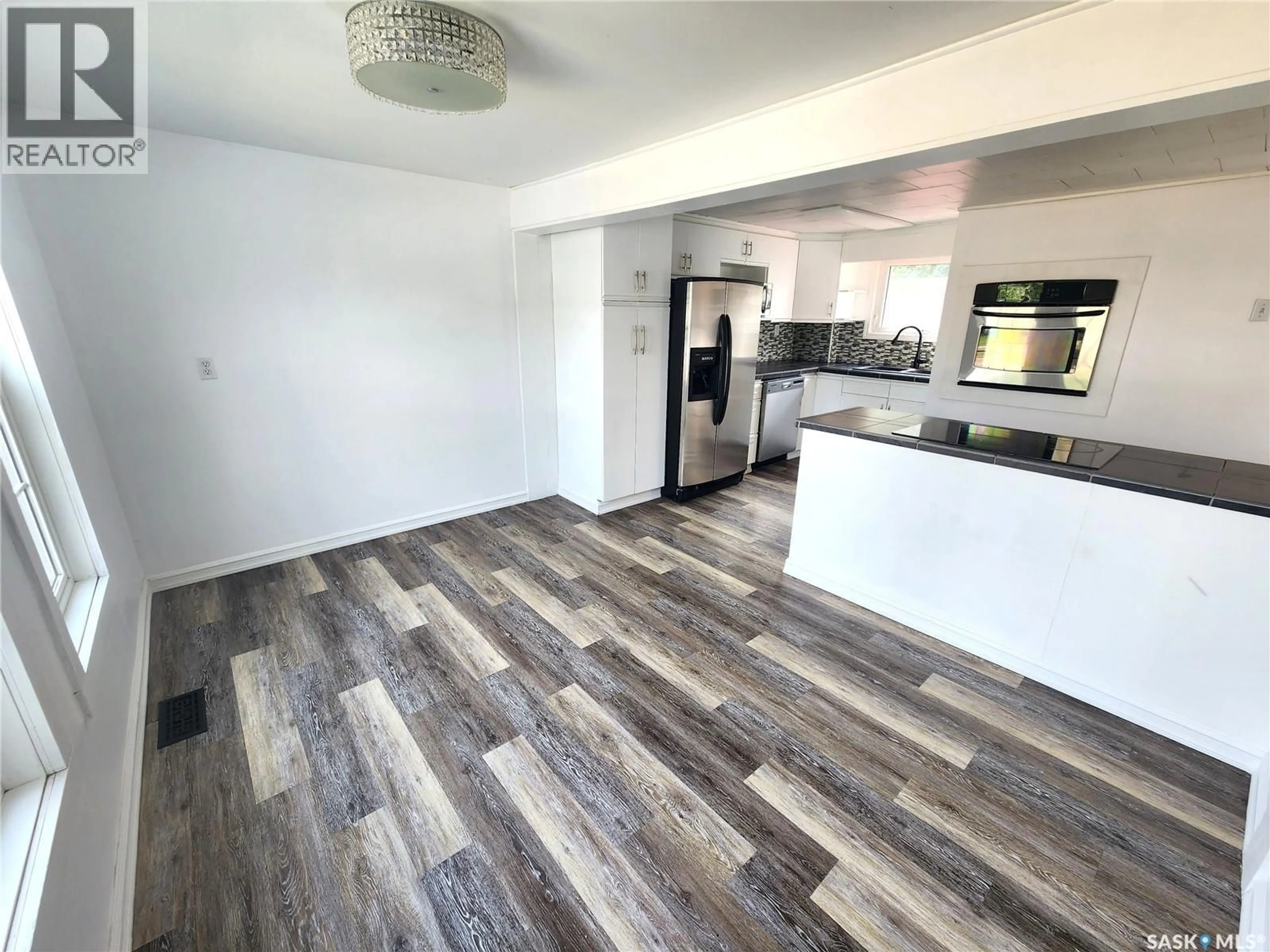Open concept kitchen, wood/laminate floor for 430 3RD STREET, Estevan Saskatchewan S4A0P2