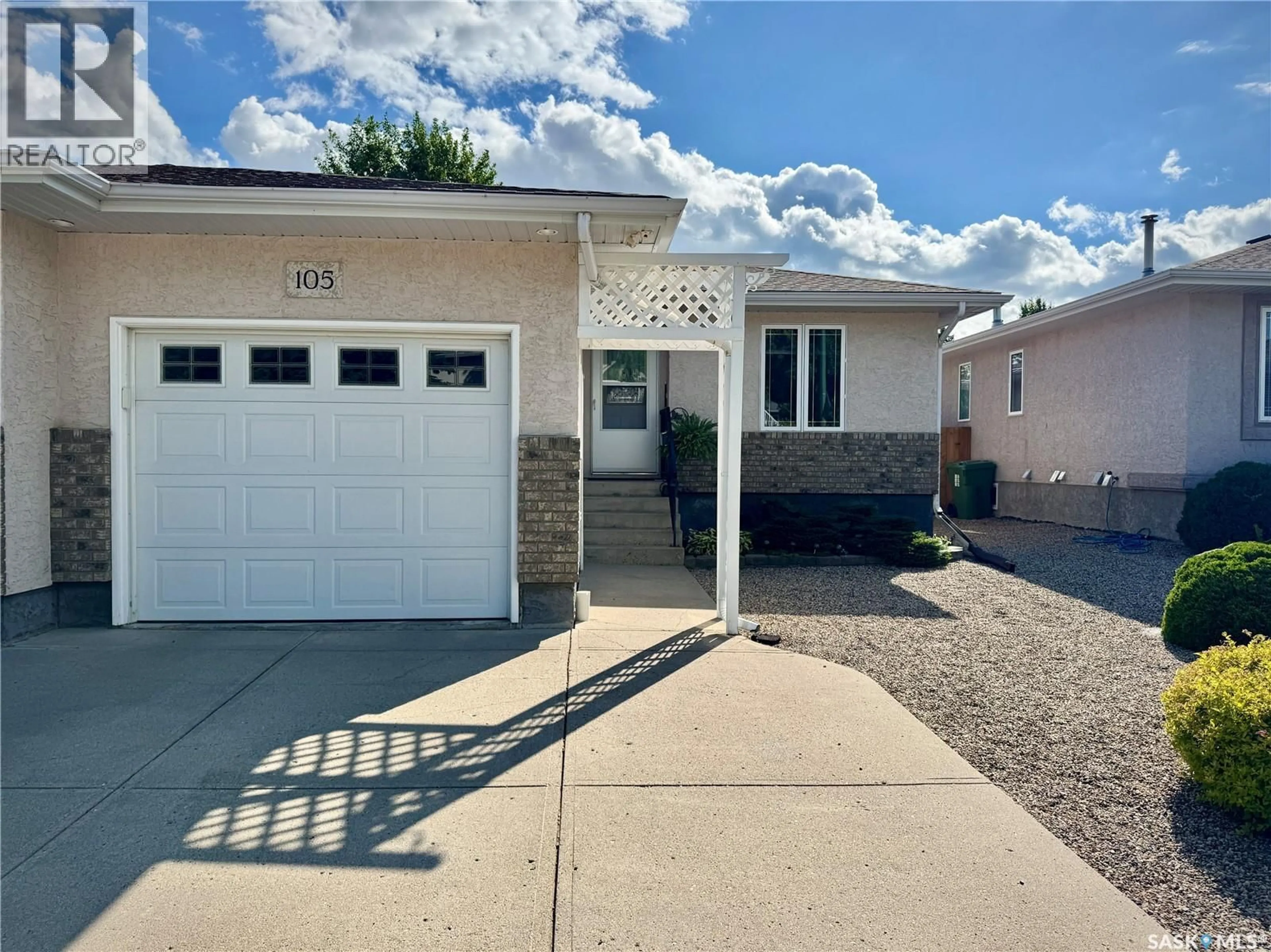 Home with vinyl exterior material, street for 105 RUSSELL DRIVE, Yorkton Saskatchewan S3N4E8