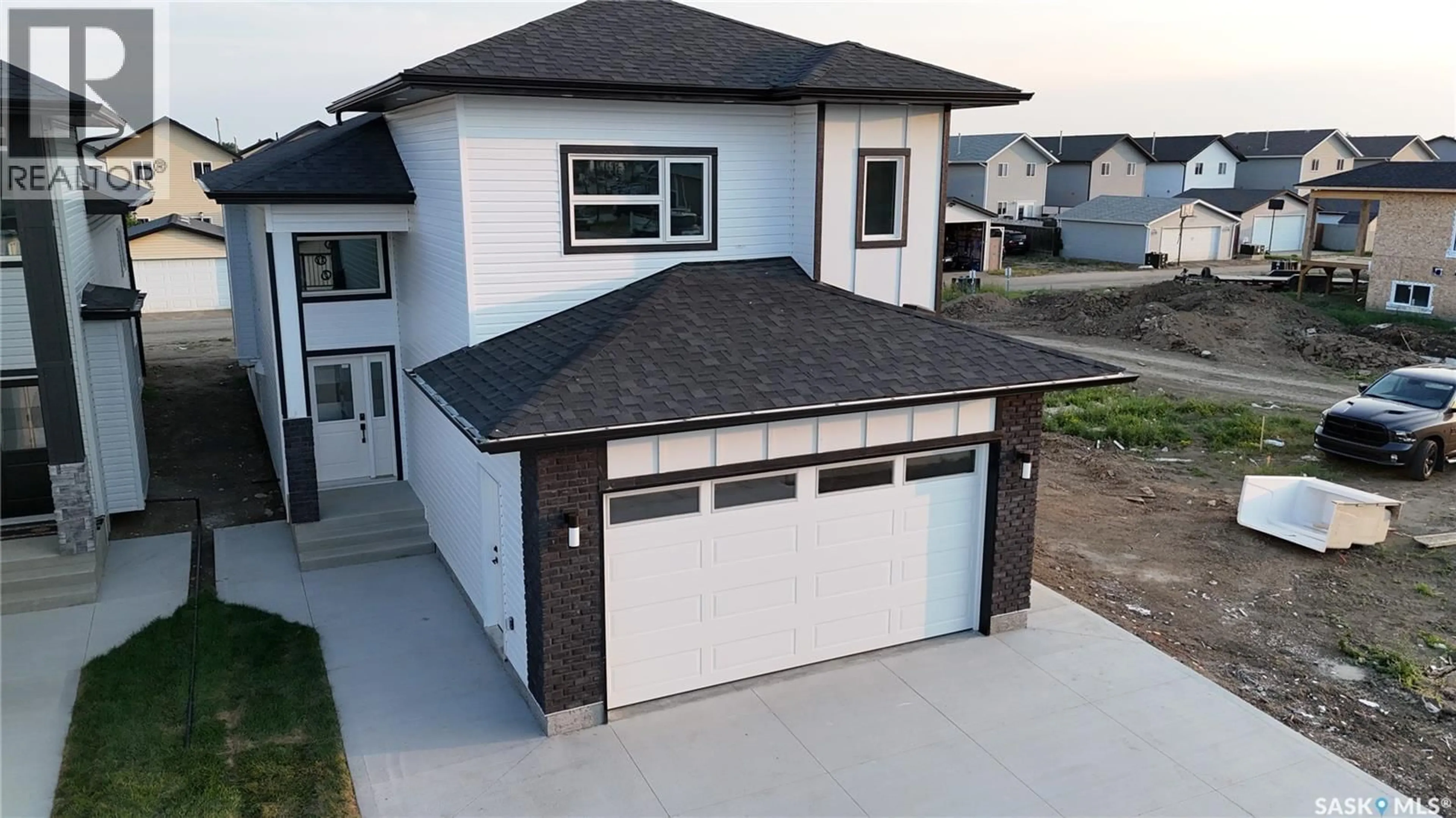 Home with vinyl exterior material, street for 1211 NIGHTINGALE TERRACE, Saskatoon Saskatchewan S7L7N5