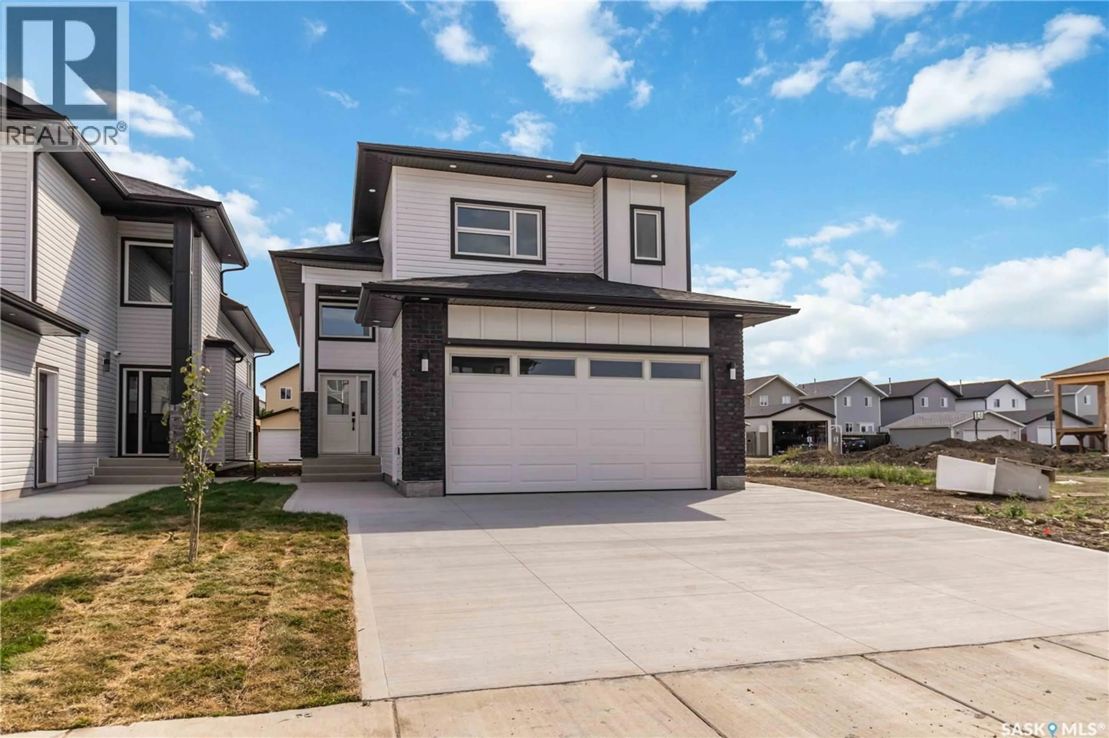 Home with vinyl exterior material, street for 1211 NIGHTINGALE TERRACE, Saskatoon Saskatchewan S7L7N5