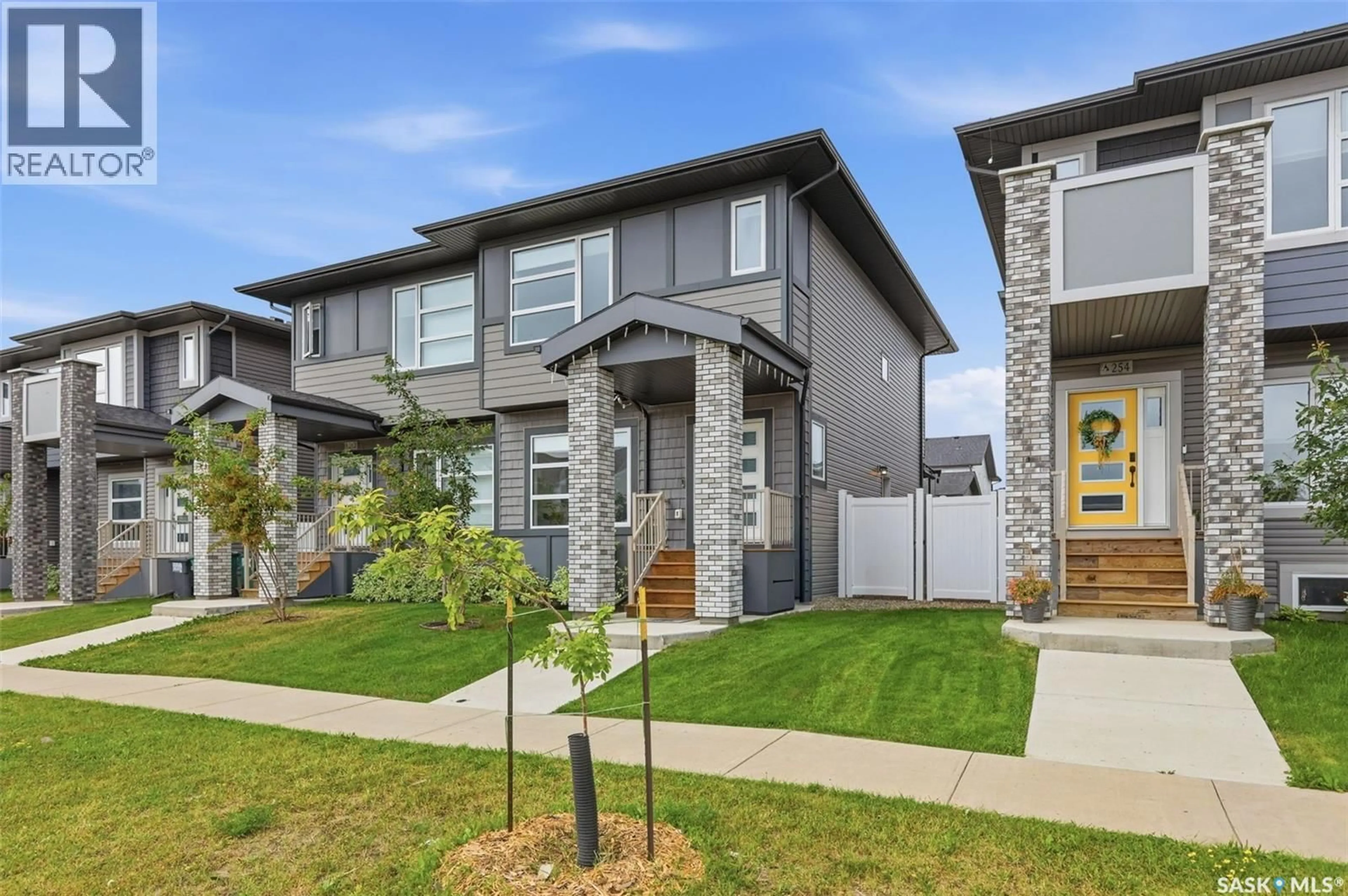 Home with vinyl exterior material, street for 258 BRIGHTON BOULEVARD, Saskatoon Saskatchewan S7V0V8