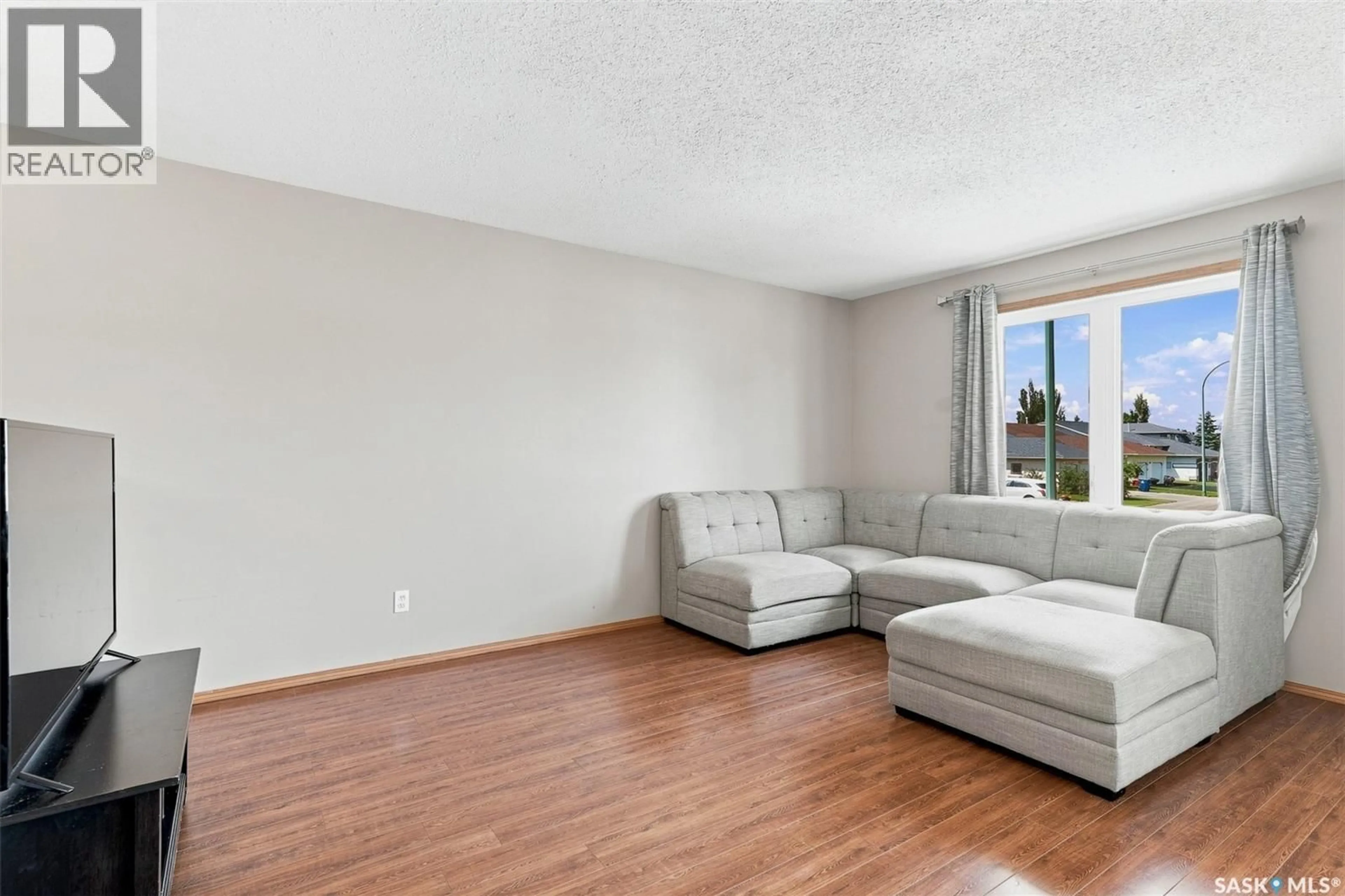 Living room with furniture, unknown for 615 PETERS STREET, Warman Saskatchewan S0K4S0