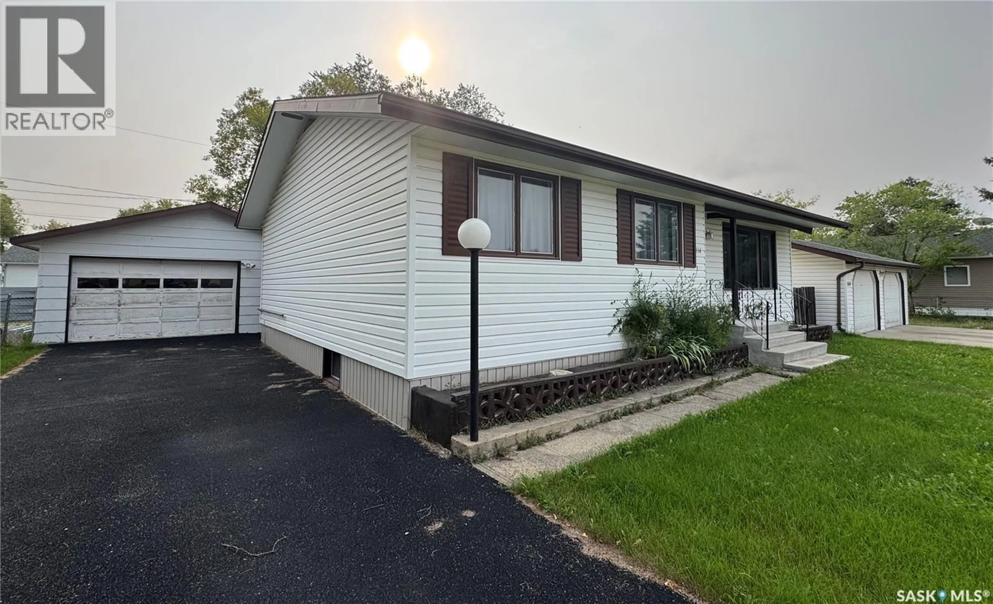 Home with vinyl exterior material, street for 114 HAMJEA STREET, Hudson Bay Saskatchewan S0E0Y0