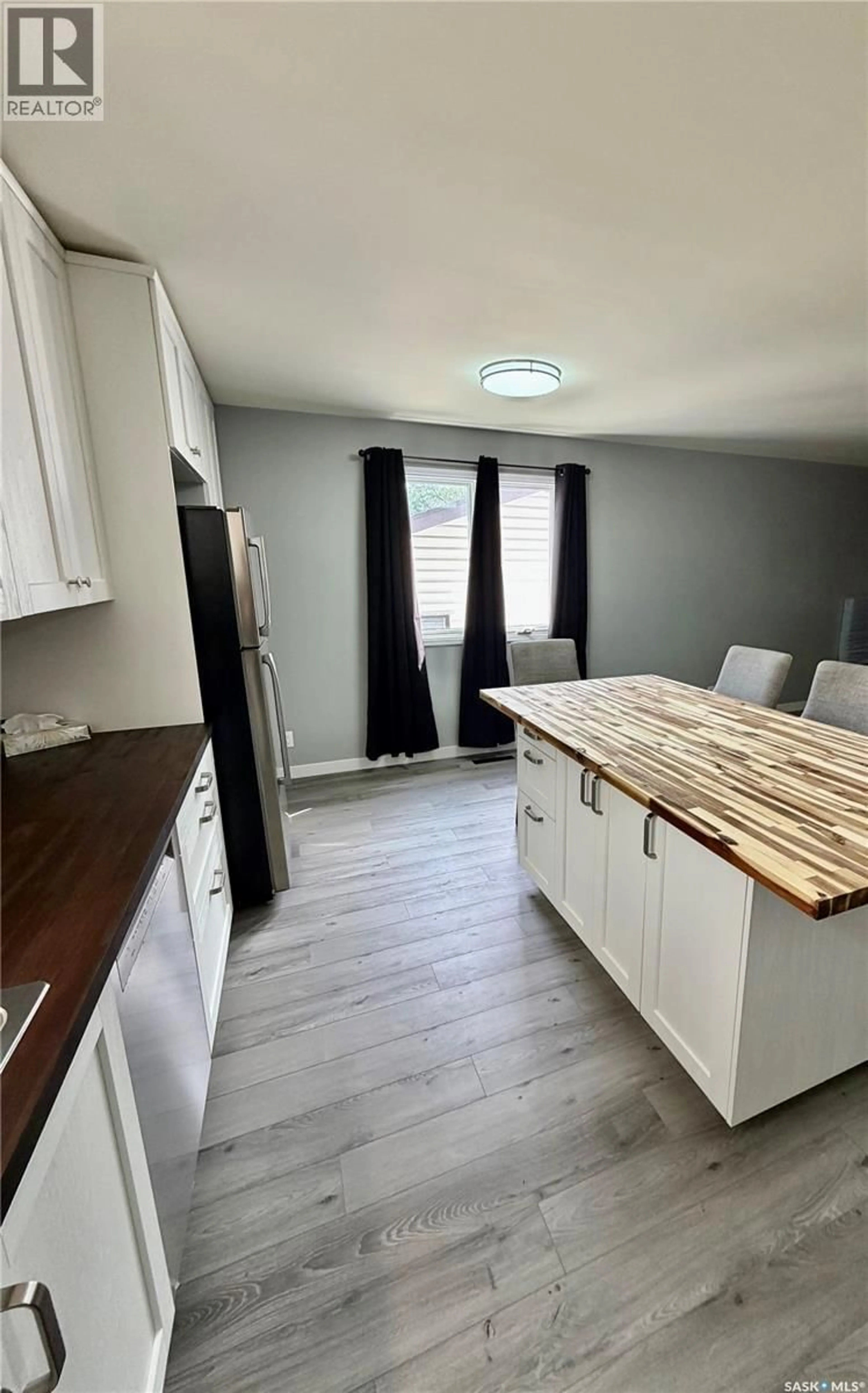 Open concept kitchen, wood/laminate floor for 114 HAMJEA STREET, Hudson Bay Saskatchewan S0E0Y0