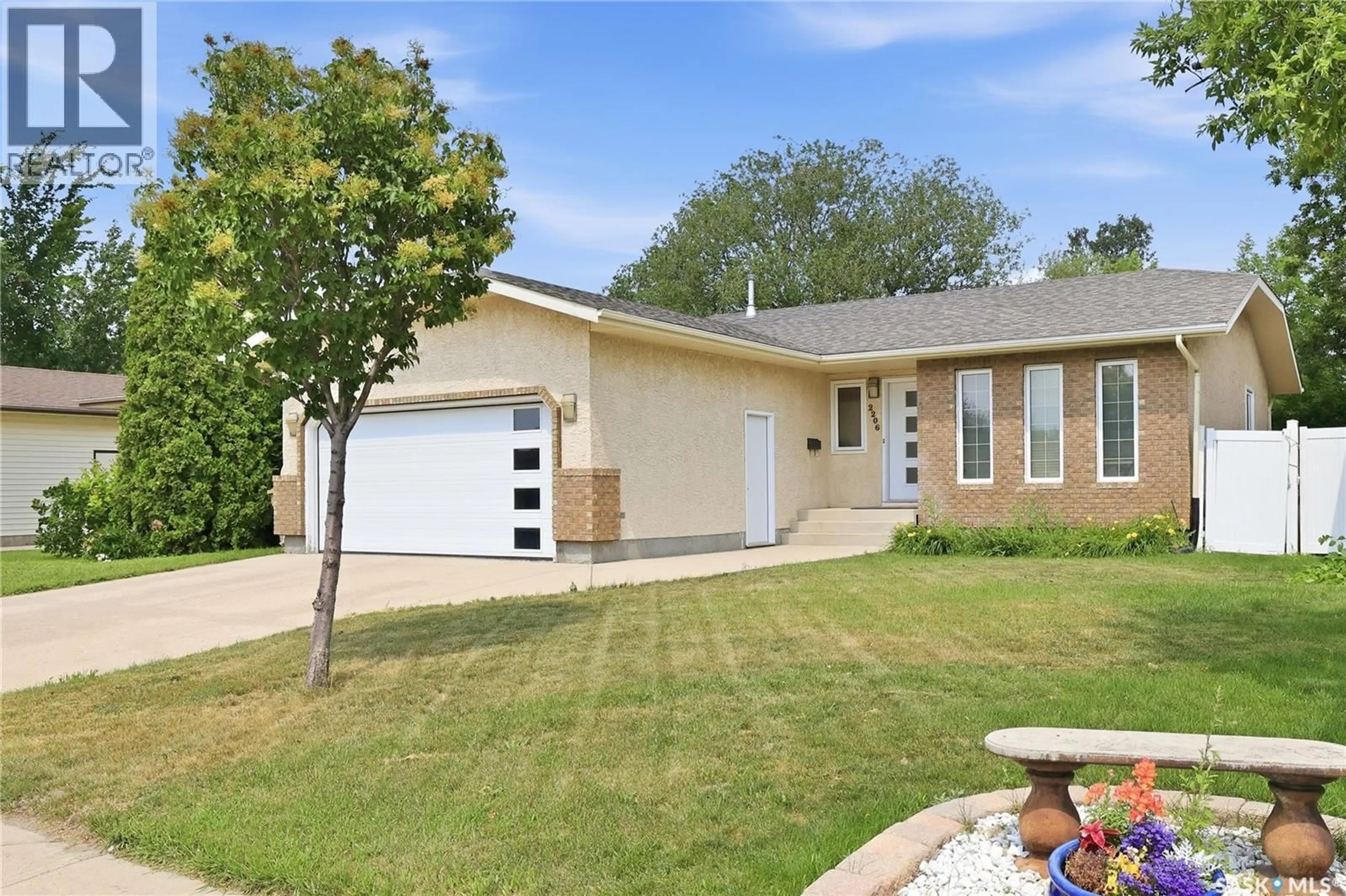Home with vinyl exterior material, street for 2206 ASSINIBOINE AVENUE, Regina Saskatchewan S4V2E8
