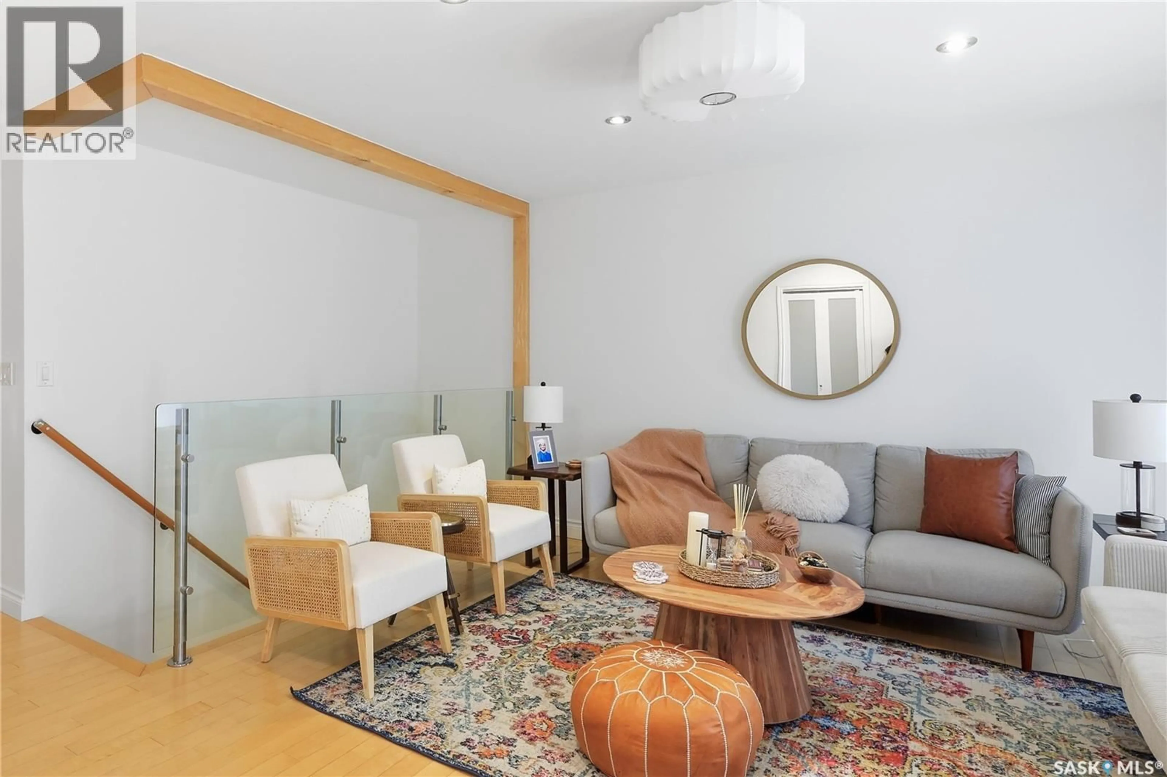 Living room with furniture, wood/laminate floor for 2206 ASSINIBOINE AVENUE, Regina Saskatchewan S4V2E8
