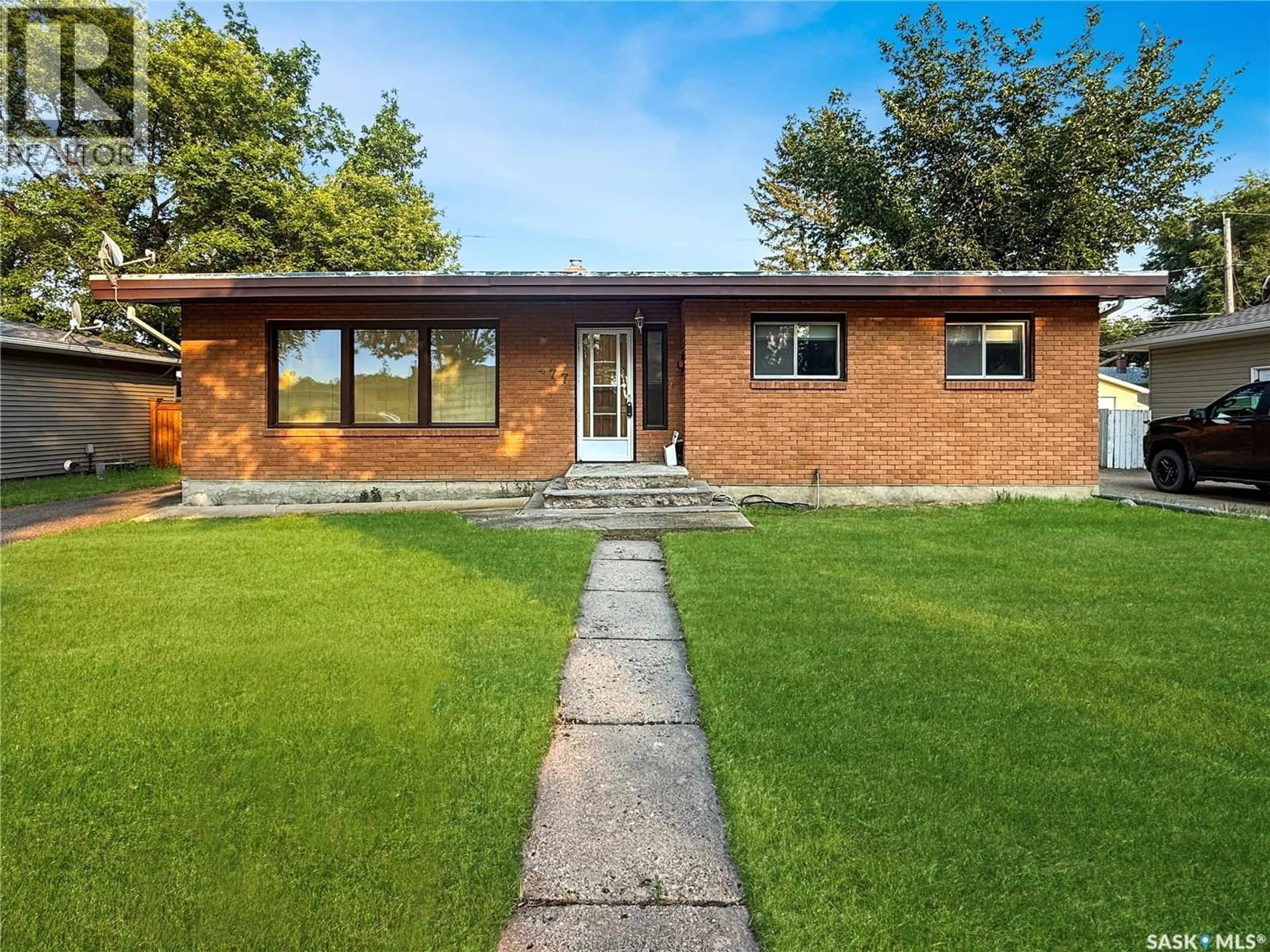 Home with brick exterior material, street for 477 3RD AVENUE, Swift Current Saskatchewan S9H3K9