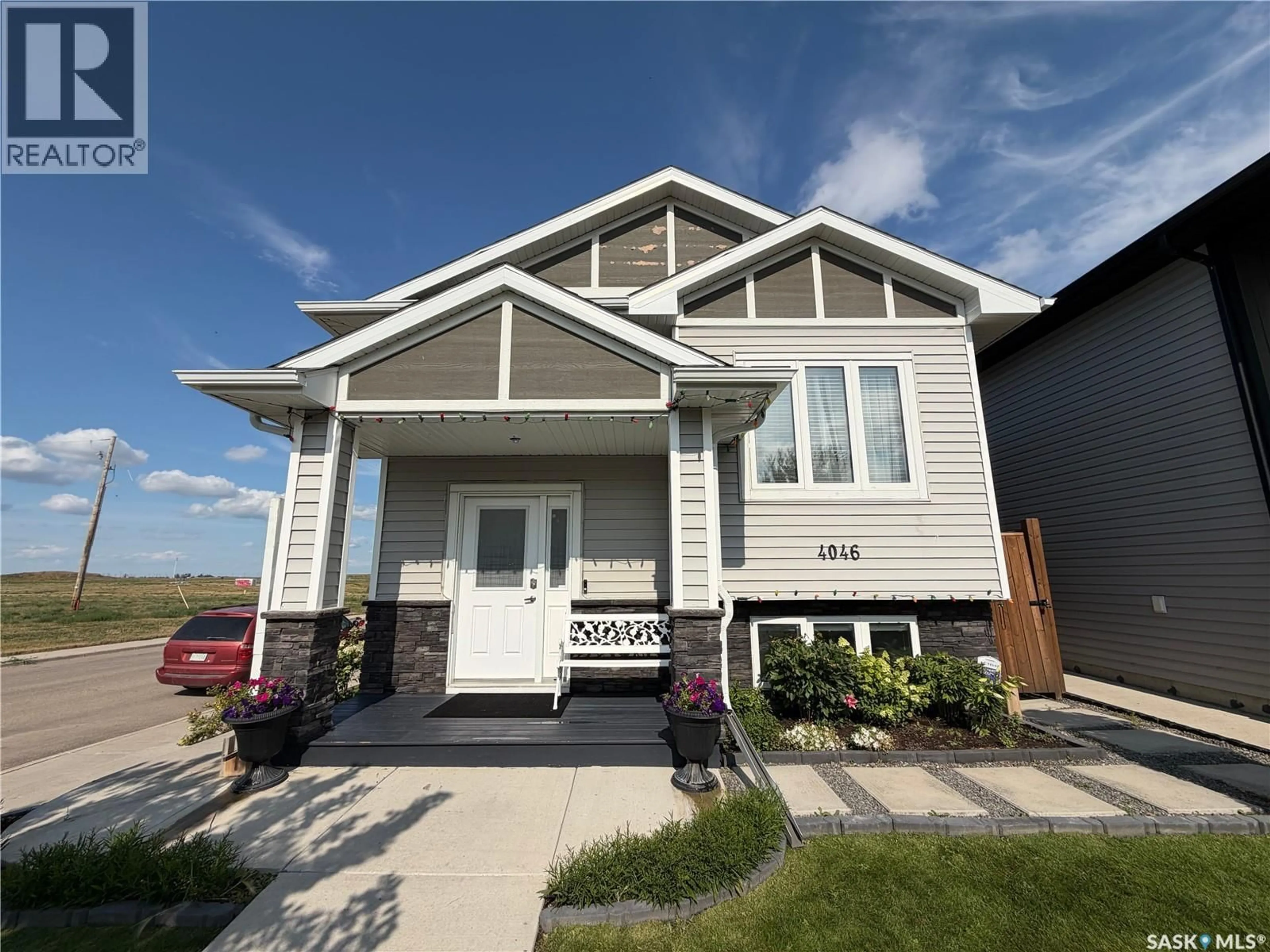 Home with vinyl exterior material, street for 4046 33RD STREET, Saskatoon Saskatchewan S7L0V6