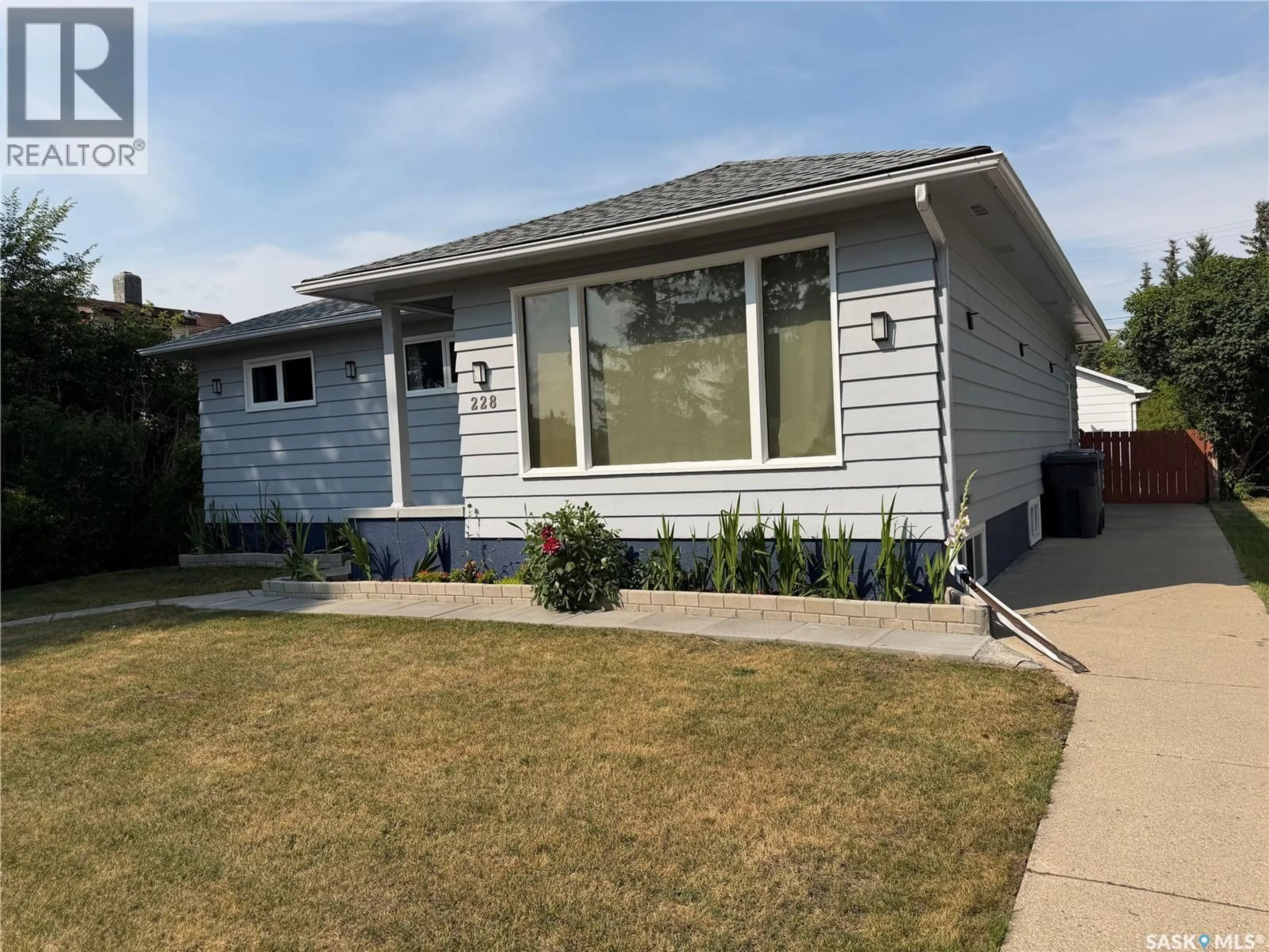 Home with vinyl exterior material, street for 228 8TH AVENUE, Melville Saskatchewan S0A2P0