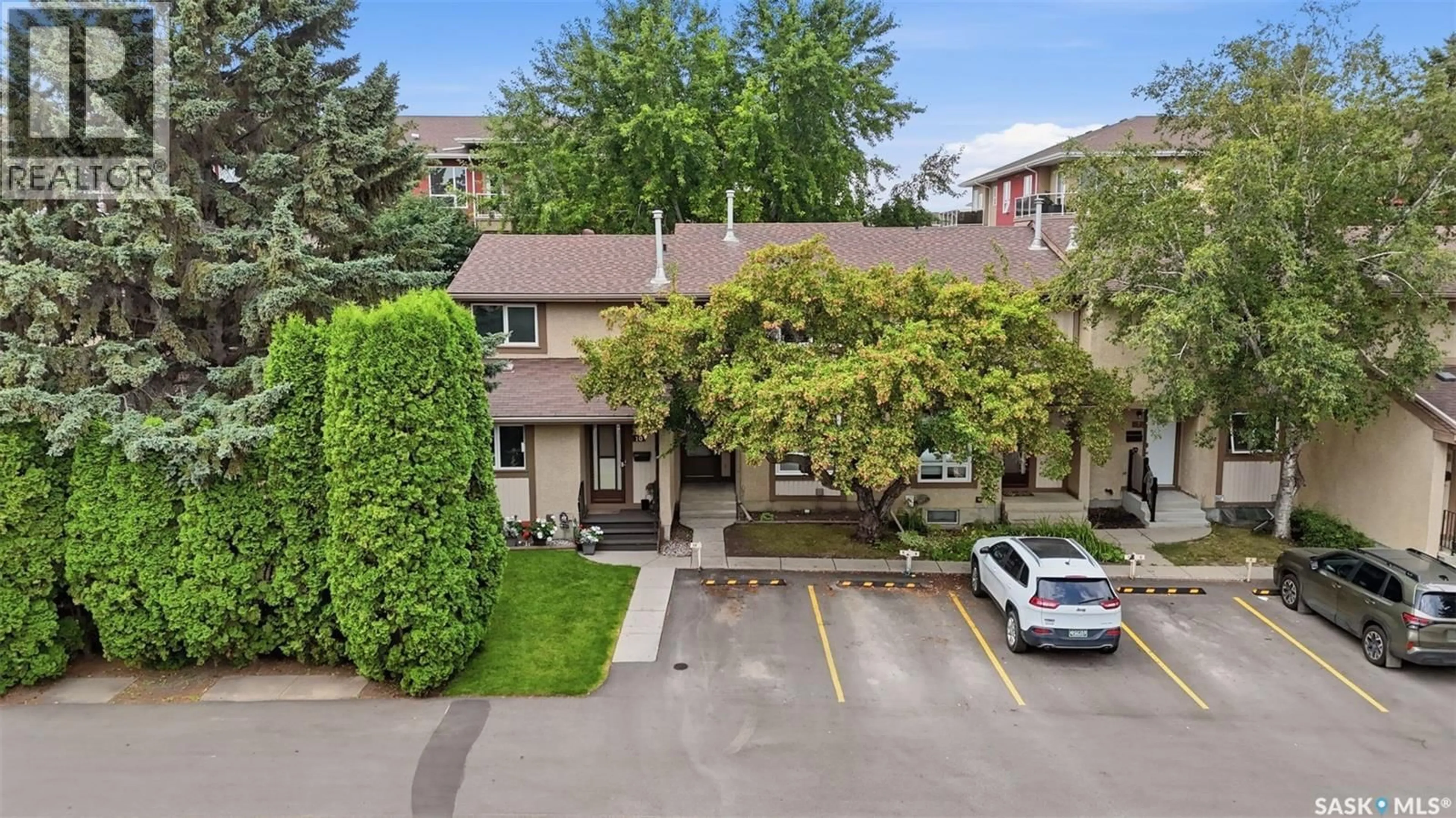 A pic from outside/outdoor area/front of a property/back of a property/a pic from drone, street for 9 - 1128 MCKERCHER DRIVE, Saskatoon Saskatchewan S7H4Y7