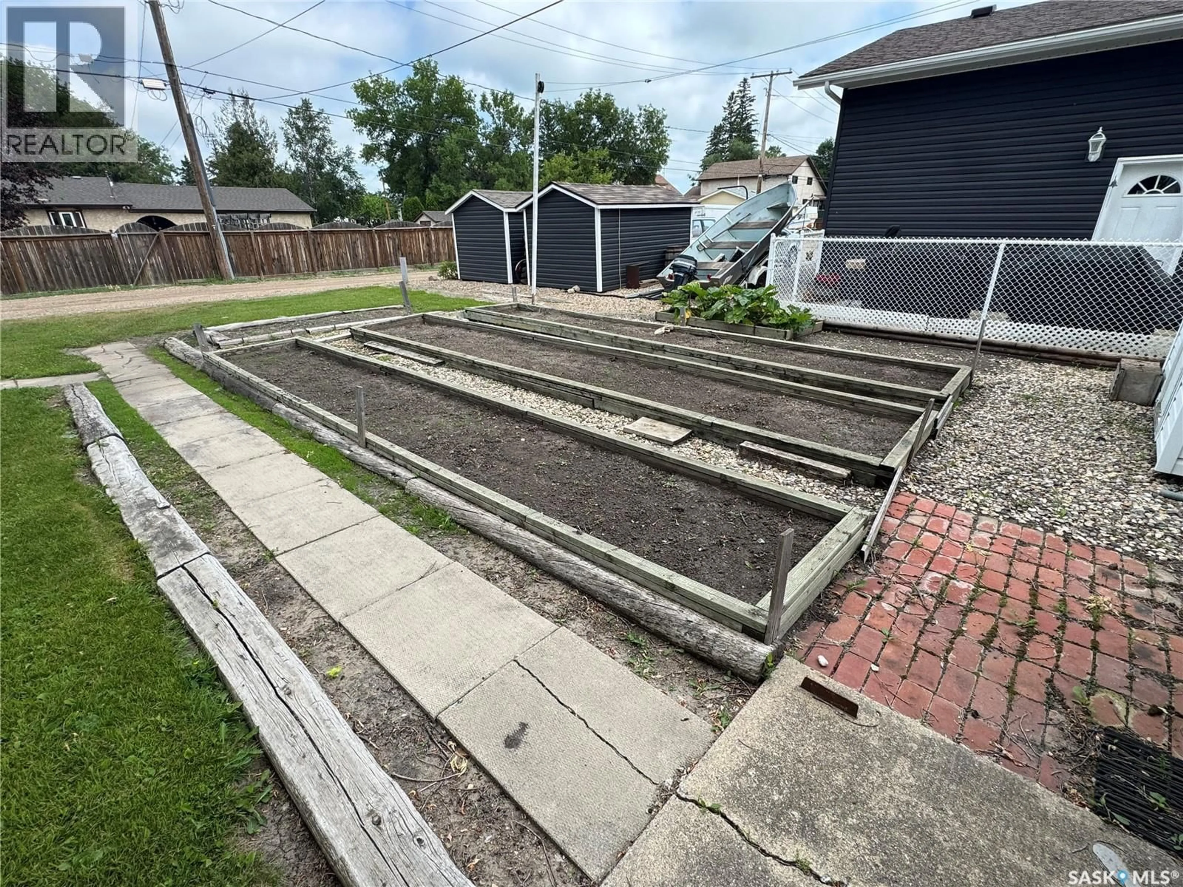 Patio, street for 817 97TH AVENUE, Tisdale Saskatchewan S0E1T0