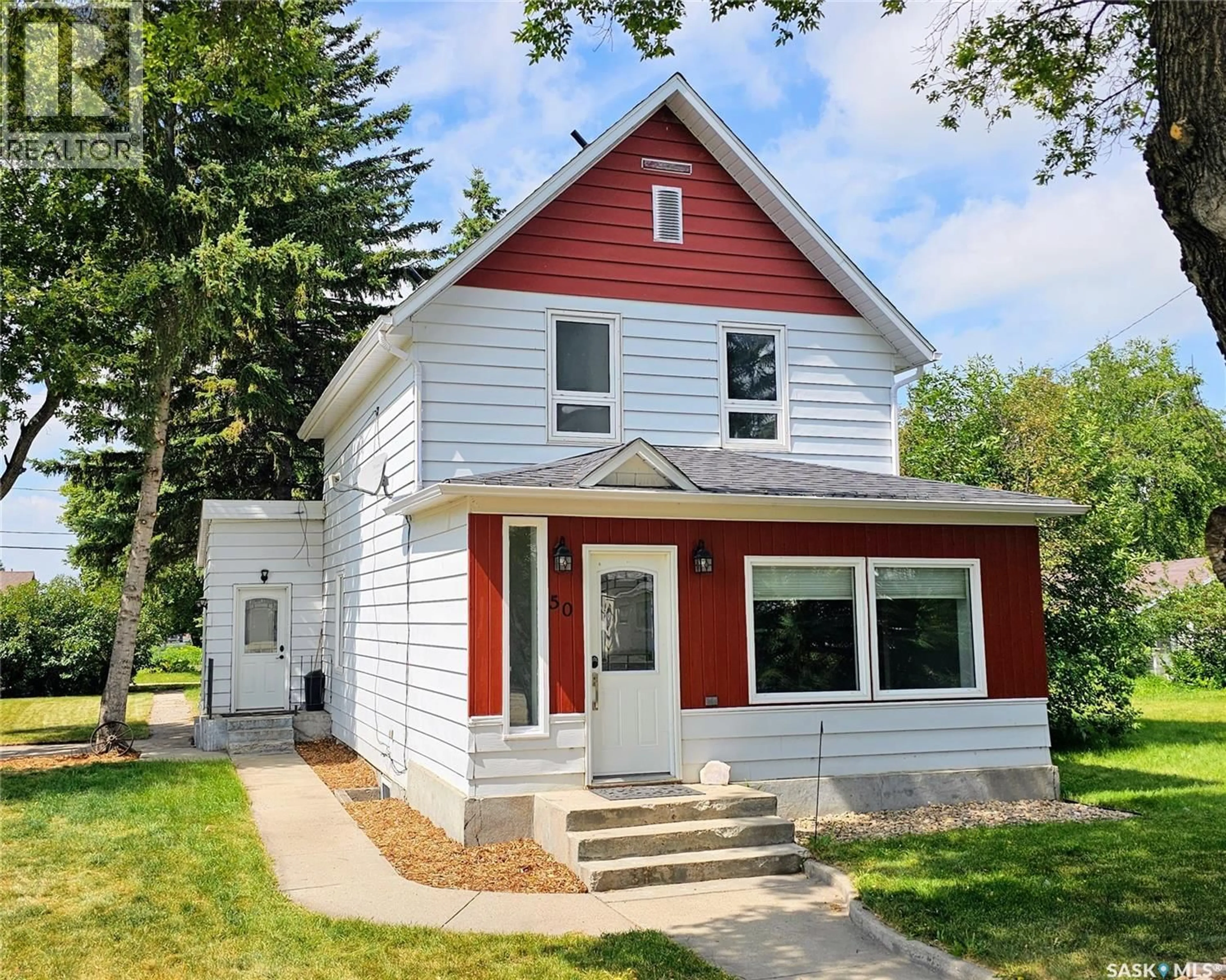 Home with vinyl exterior material, street for 50 ANTRIM STREET, Lanigan Saskatchewan S0K2M0