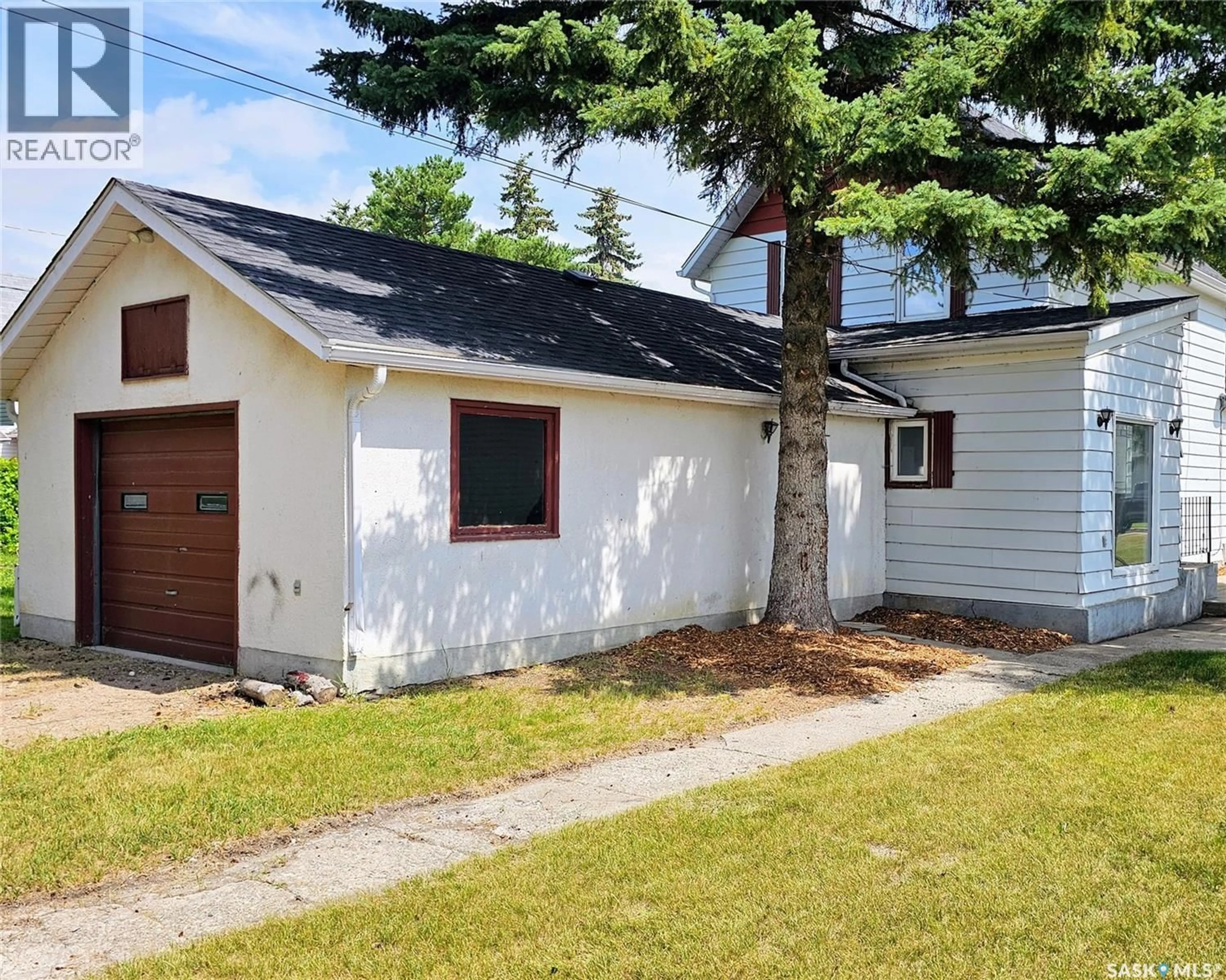 Home with vinyl exterior material, street for 50 ANTRIM STREET, Lanigan Saskatchewan S0K2M0