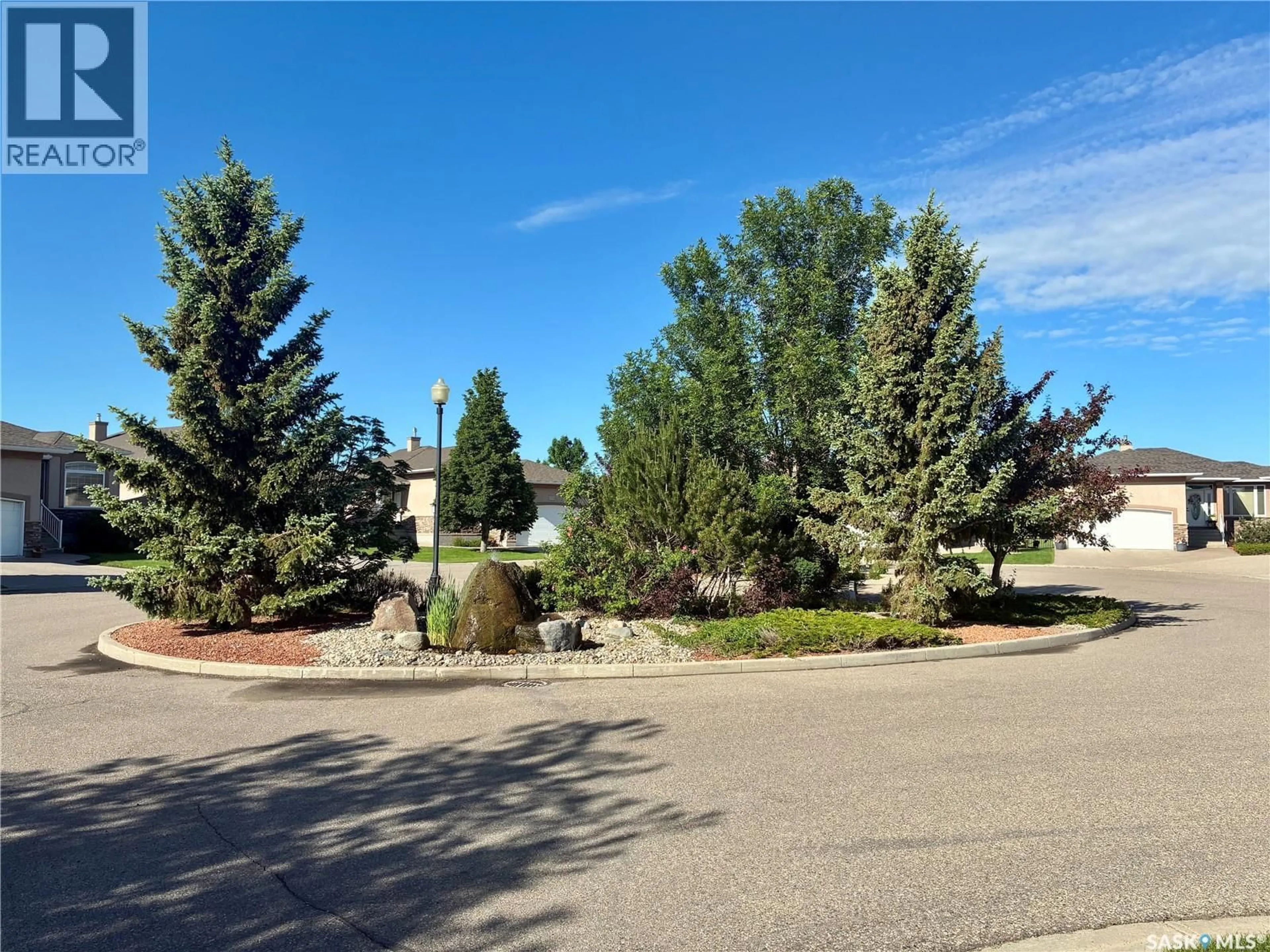 A pic from outside/outdoor area/front of a property/back of a property/a pic from drone, mountain view for 10170 WASCANA ESTATES, Regina Saskatchewan S4V3E5