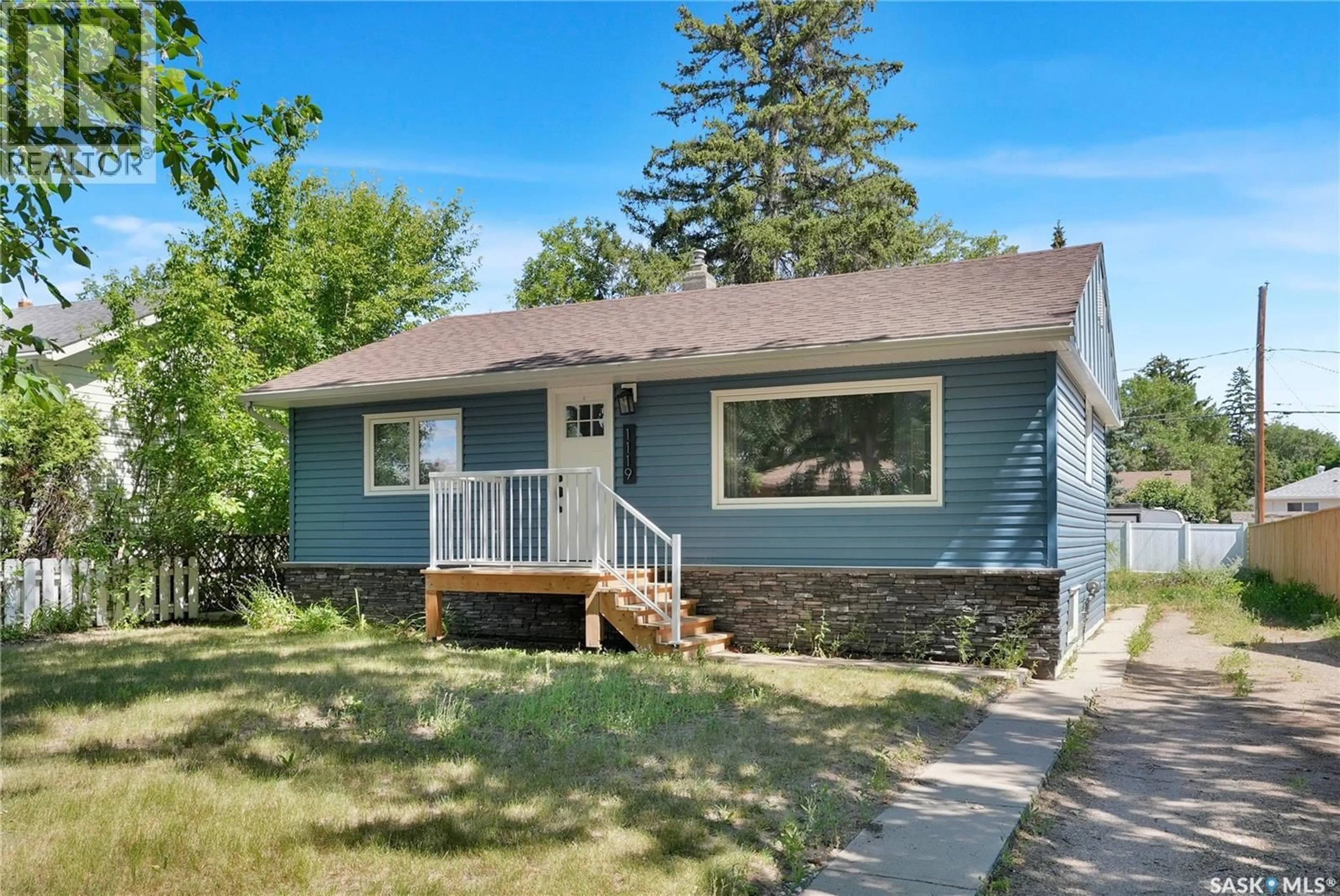 Home with vinyl exterior material, street for 1119 ELGIN AVENUE, Moose Jaw Saskatchewan S6H4G9