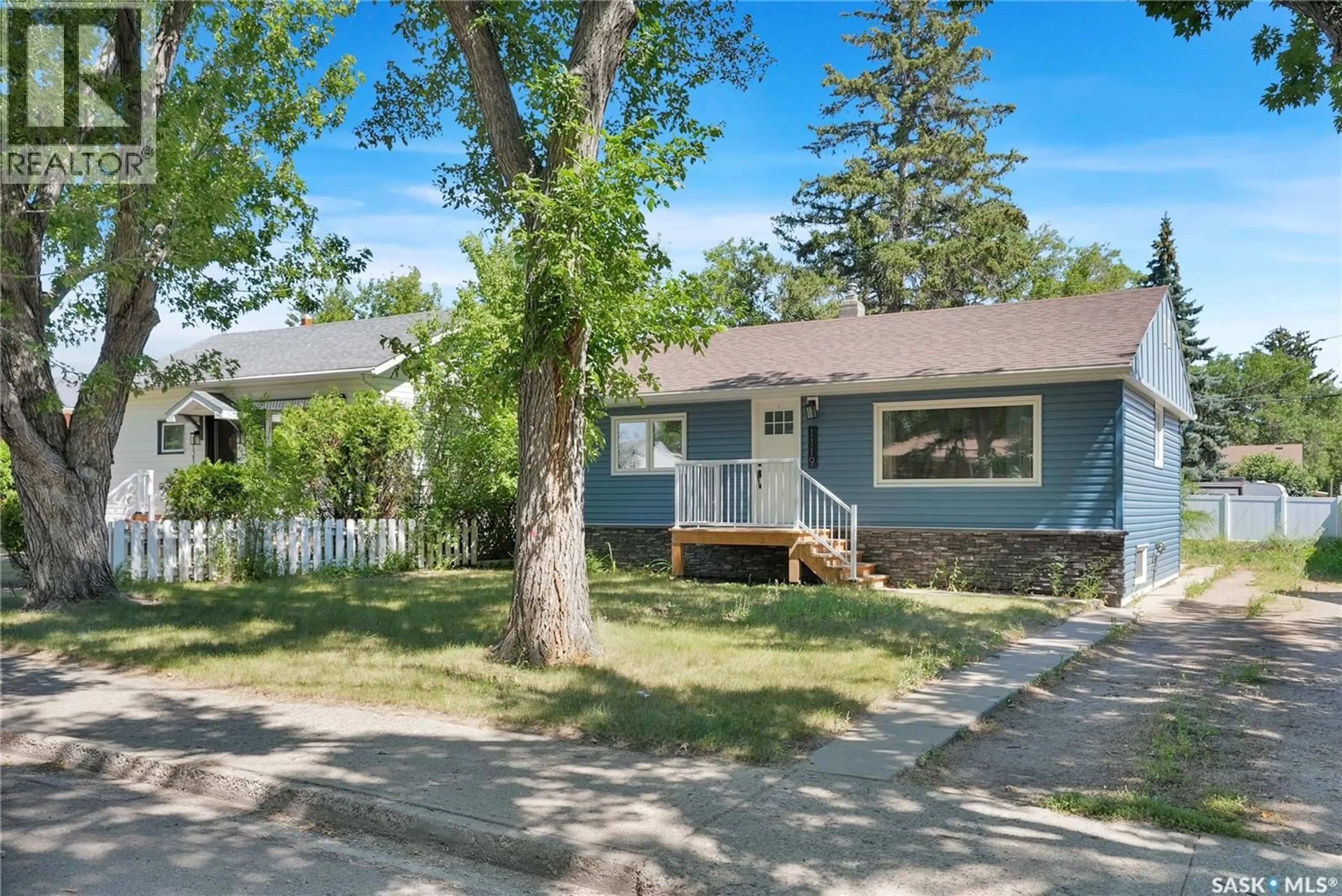 Home with vinyl exterior material, street for 1119 ELGIN AVENUE, Moose Jaw Saskatchewan S6H4G9