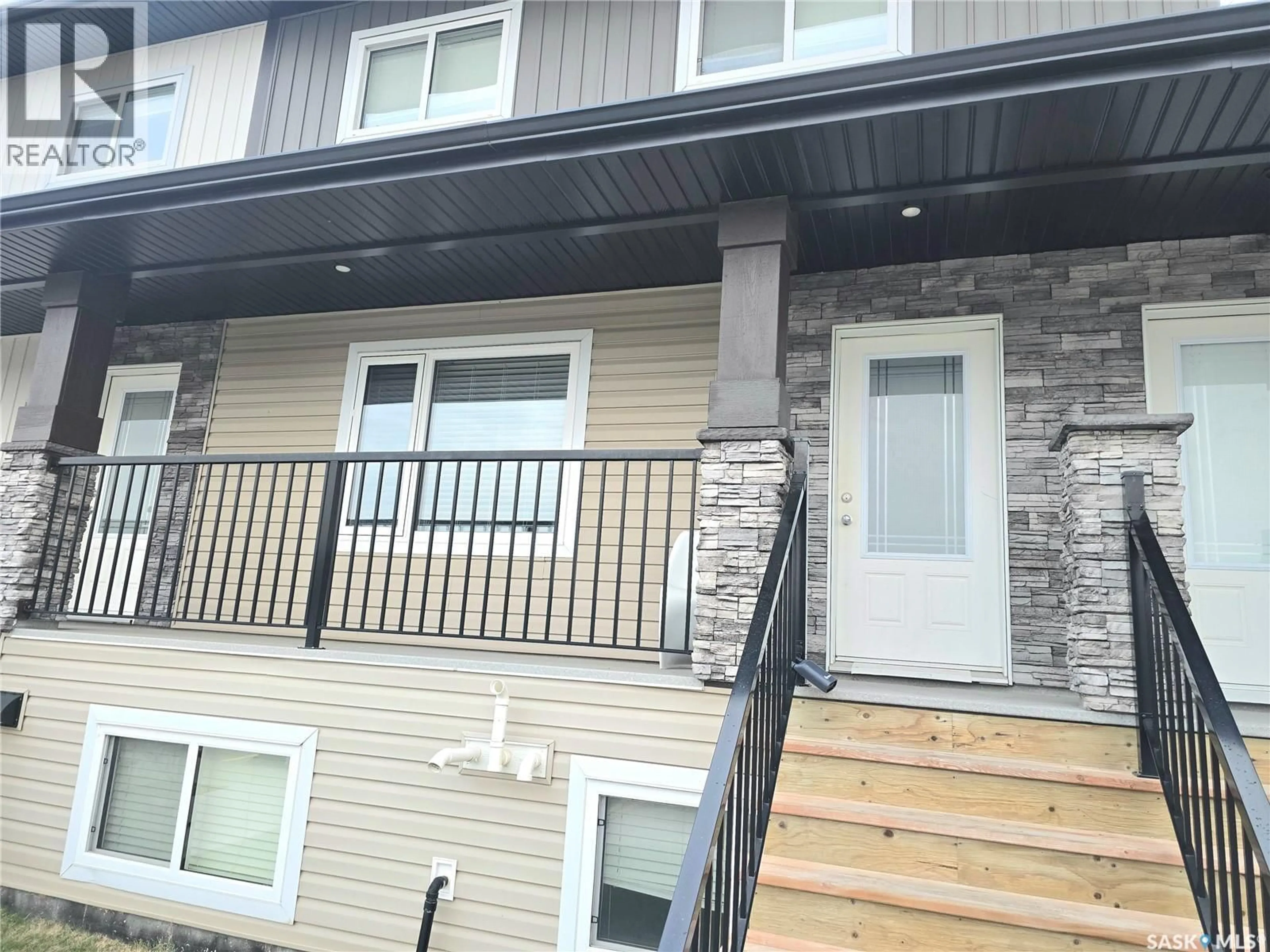 Home with vinyl exterior material, street for 110 - 510 AKHTAR BEND, Saskatoon Saskatchewan S7W0Y9