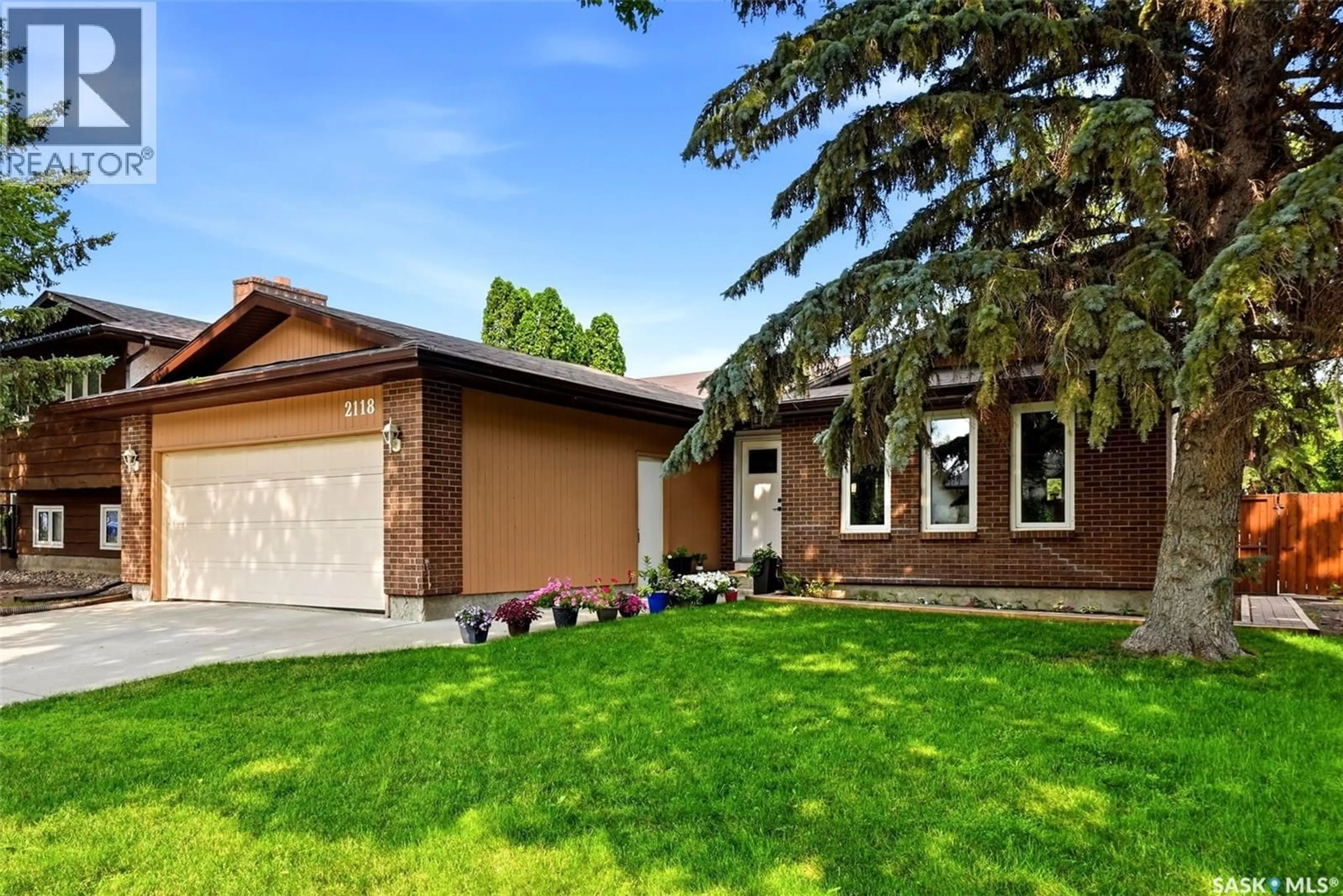 Home with brick exterior material, street for 2118 ELDERKIN DRIVE, Regina Saskatchewan S4V1N7